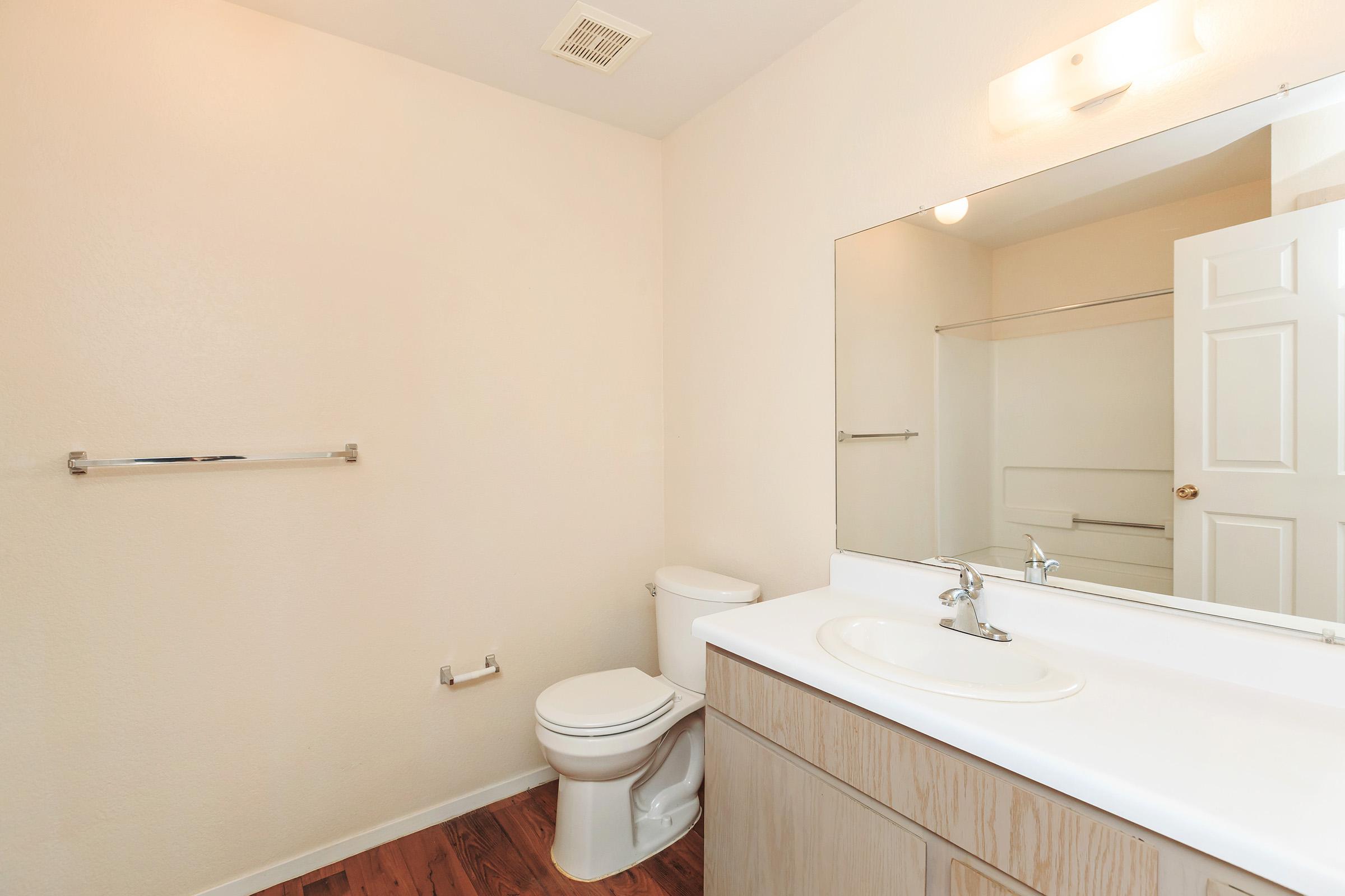 a large white tub sitting next to a sink