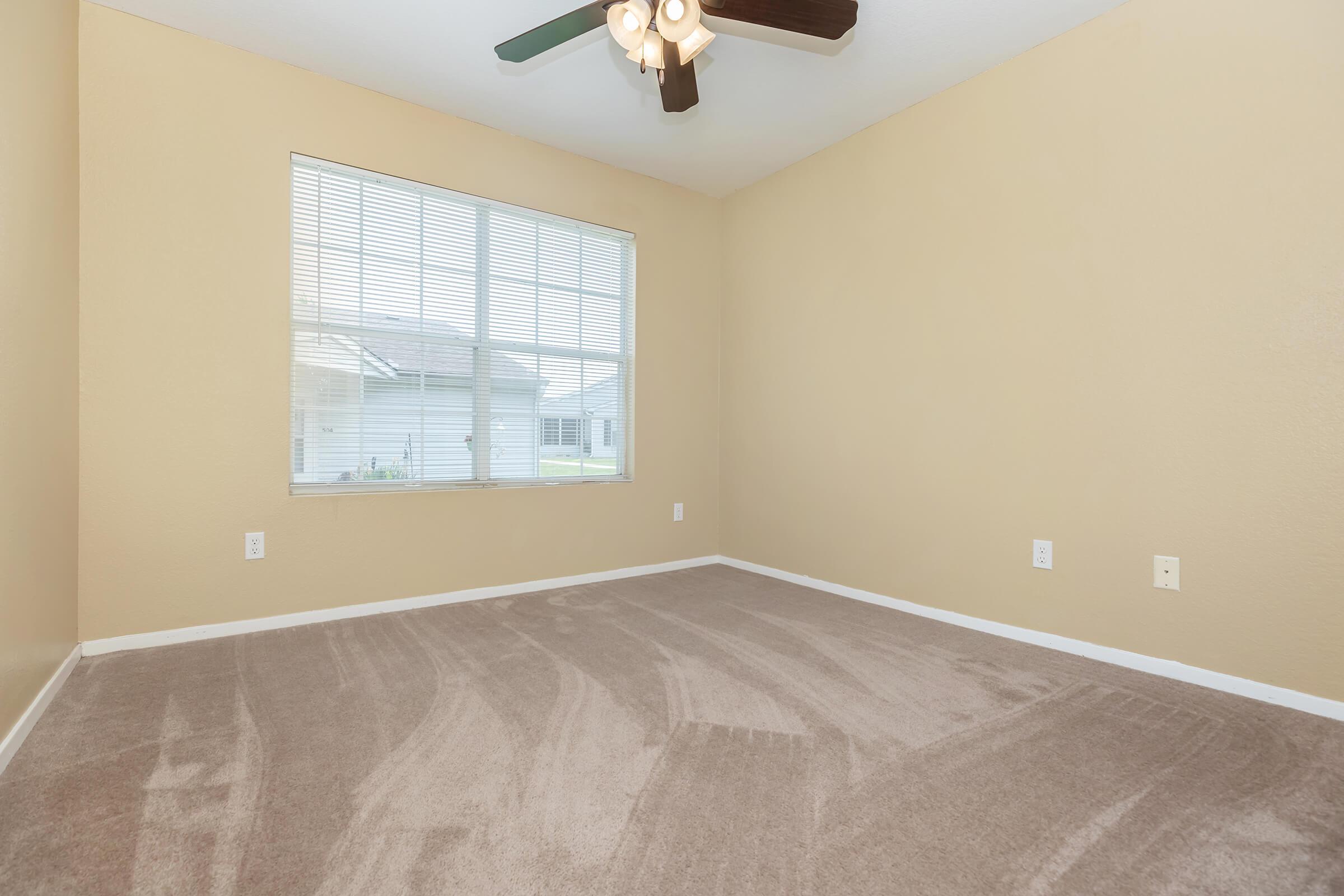 a bedroom with a large window