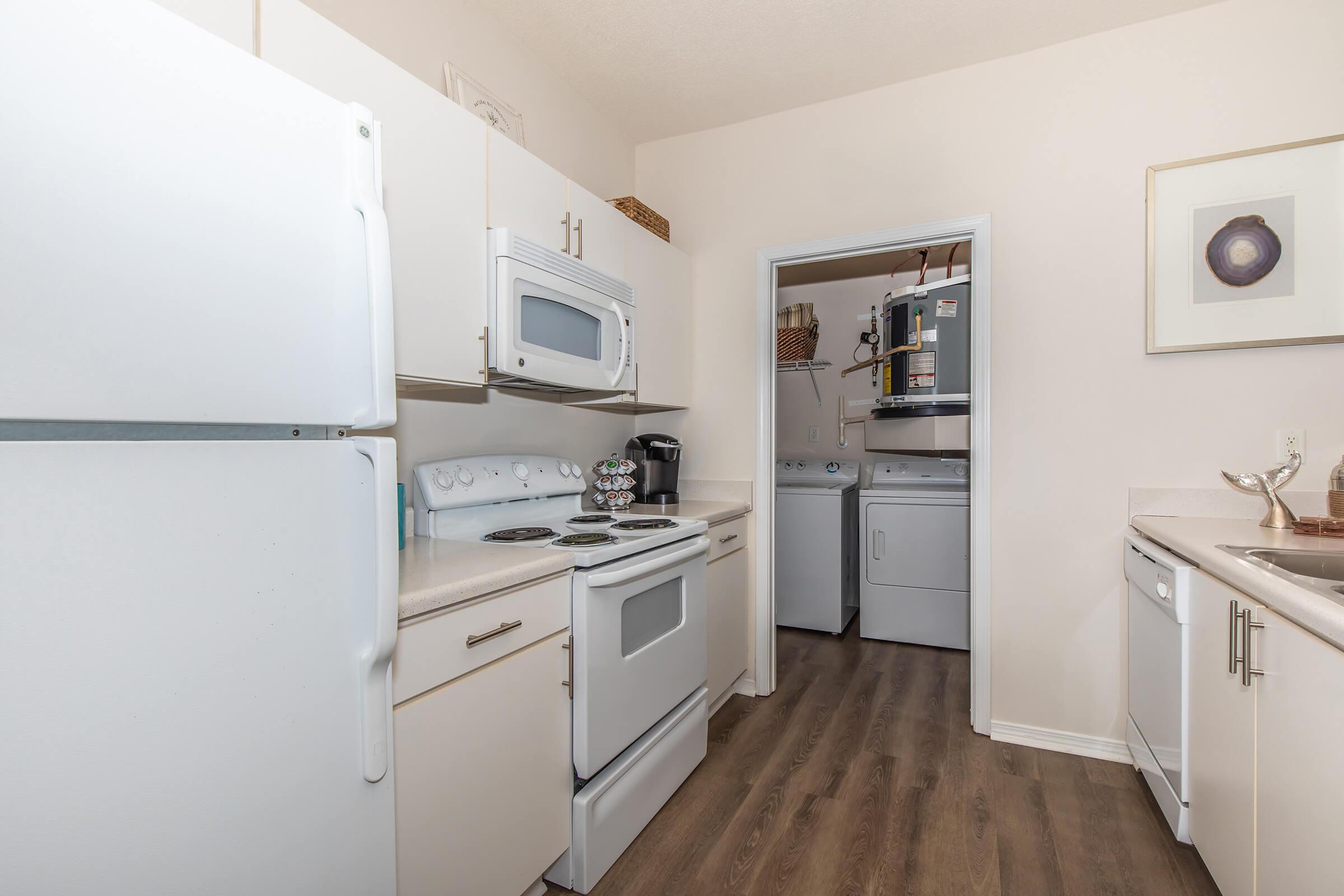 a kitchen with a stove and a refrigerator