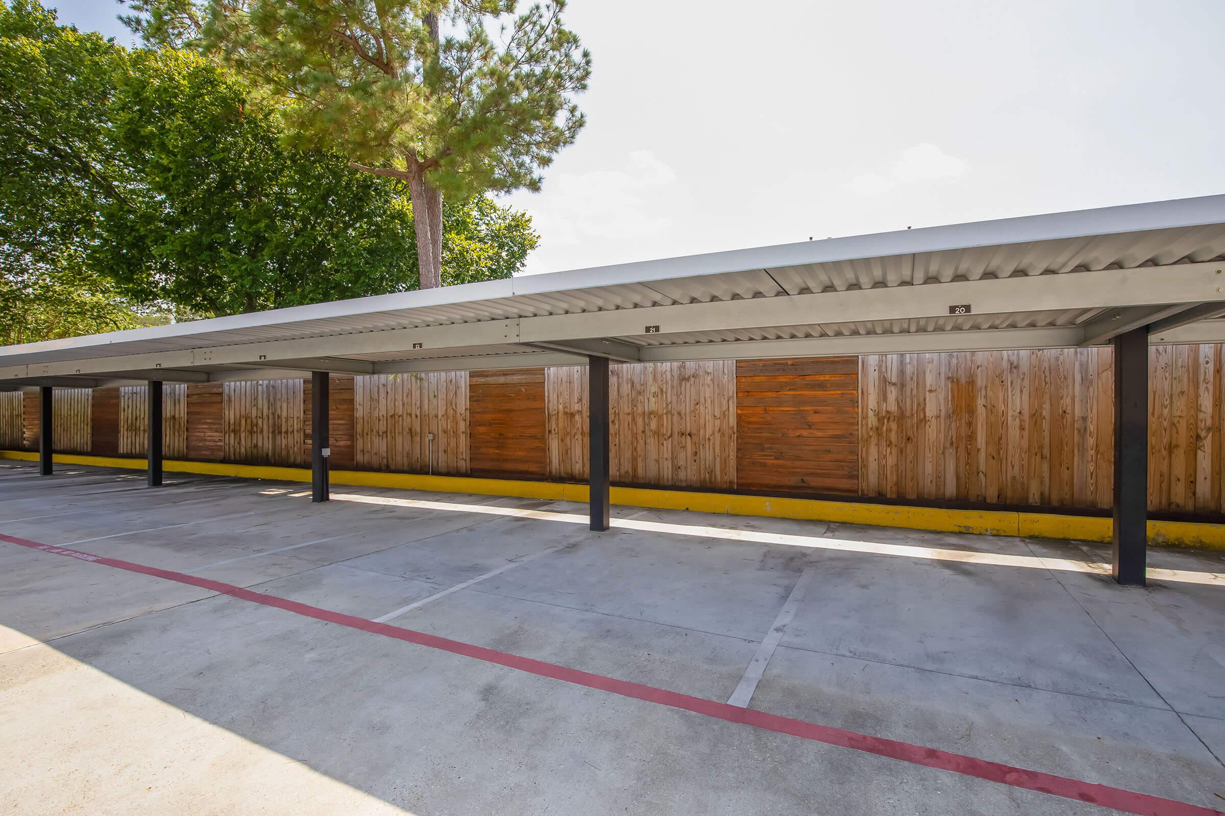 a train is parked on the side of a fence