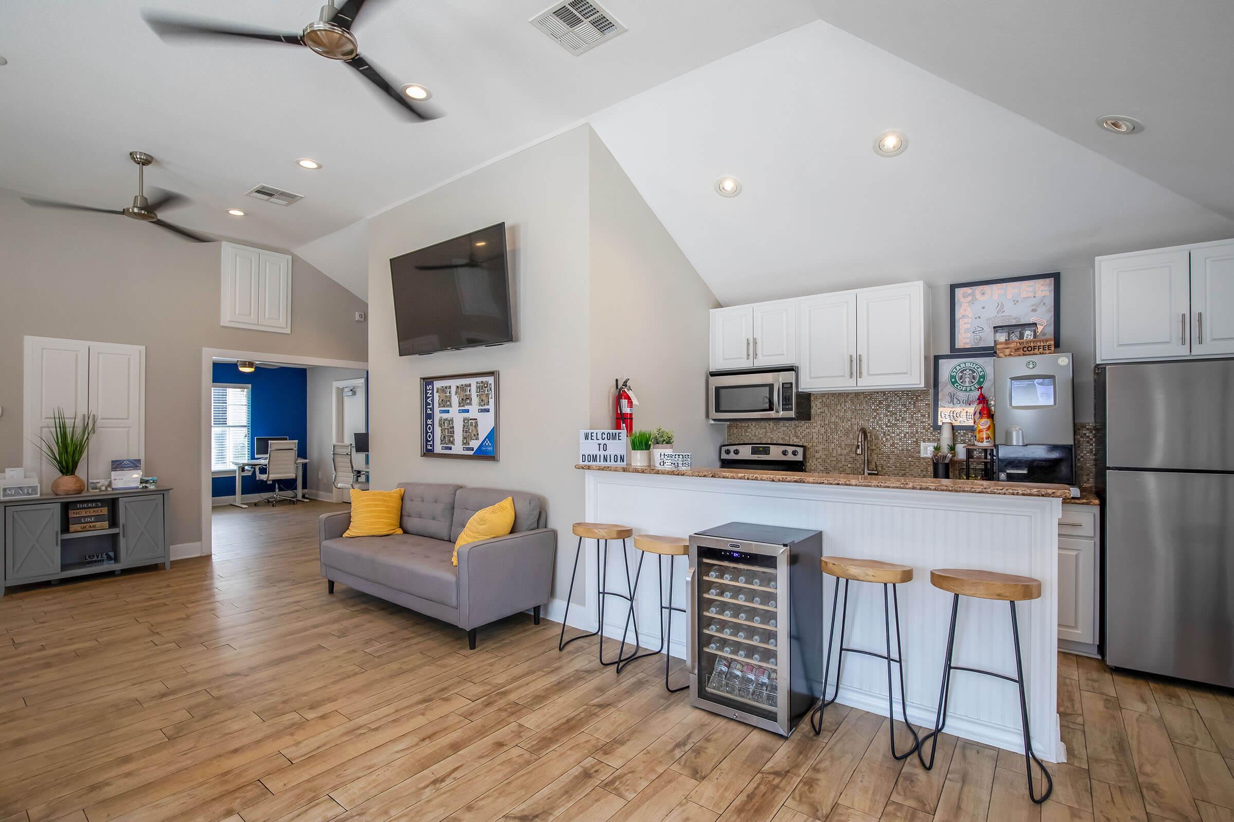 a kitchen with a wood floor in a room