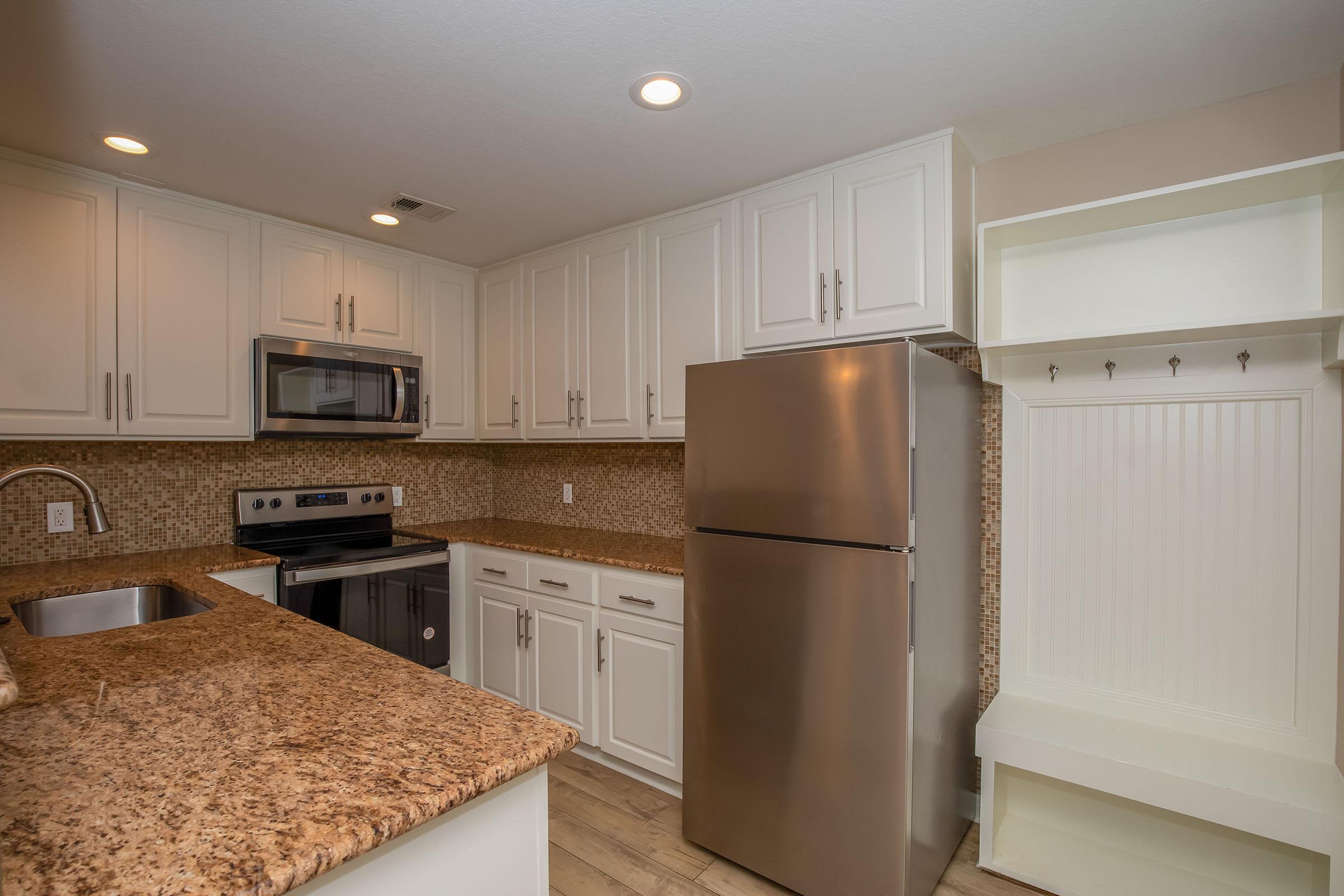 a stainless steel refrigerator in a kitchen