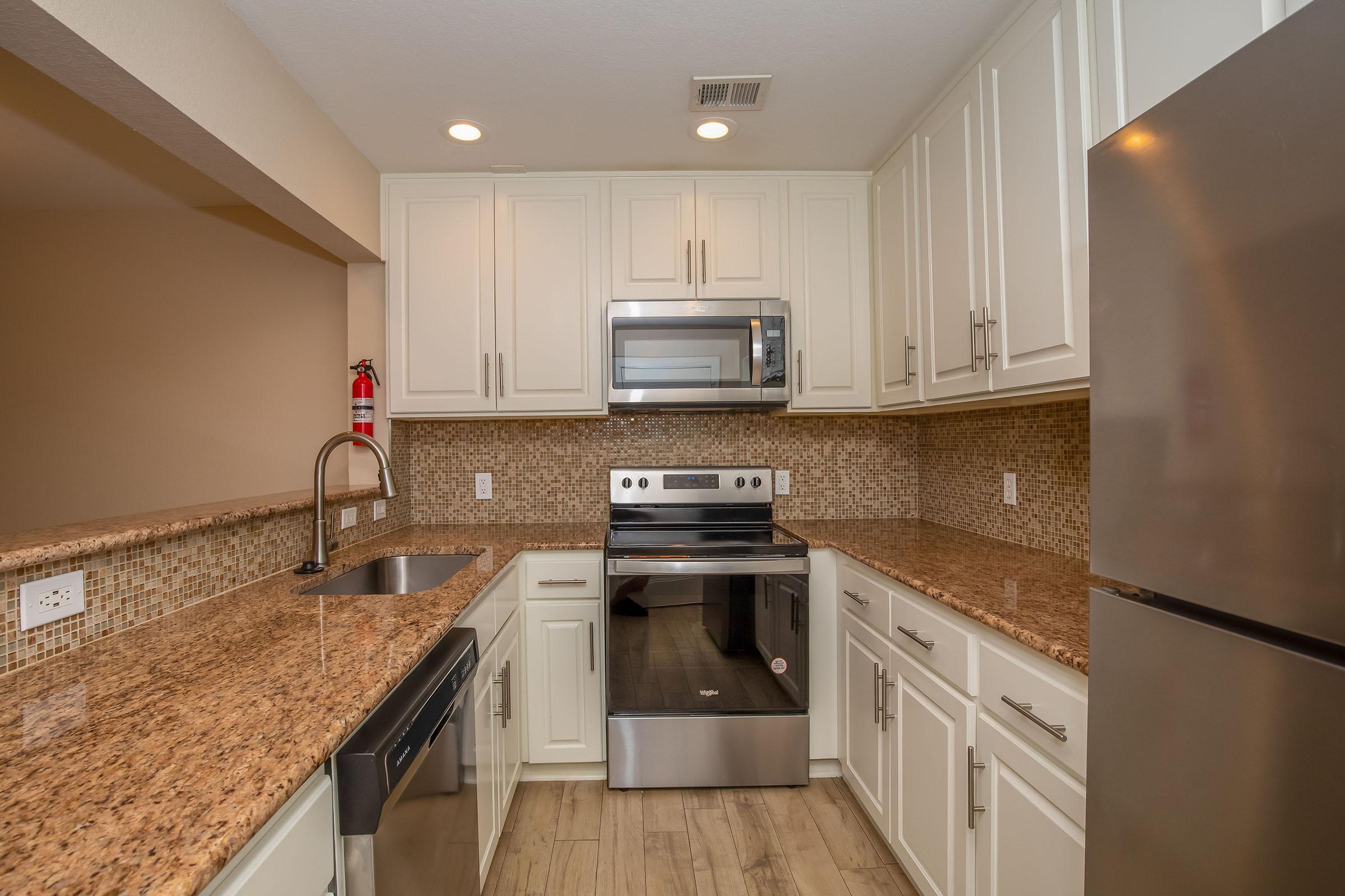 a kitchen with stainless steel appliances