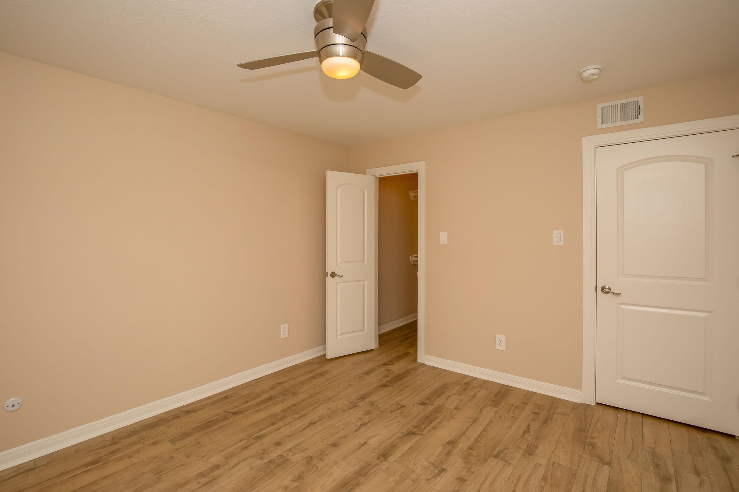 a kitchen with a wooden floor