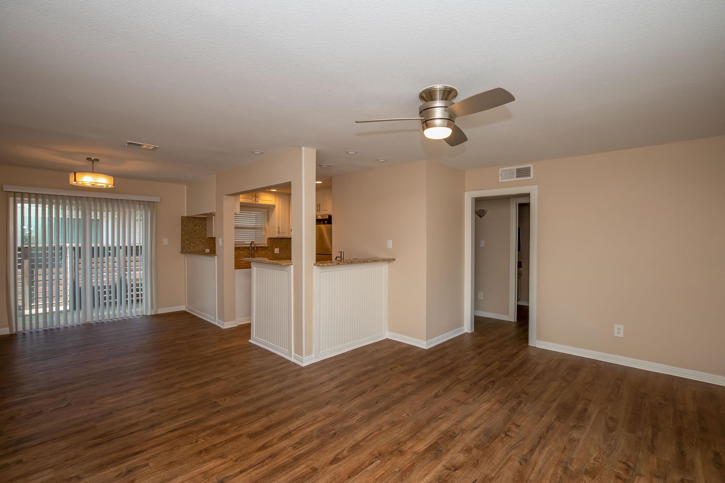 a large empty room with a wood floor