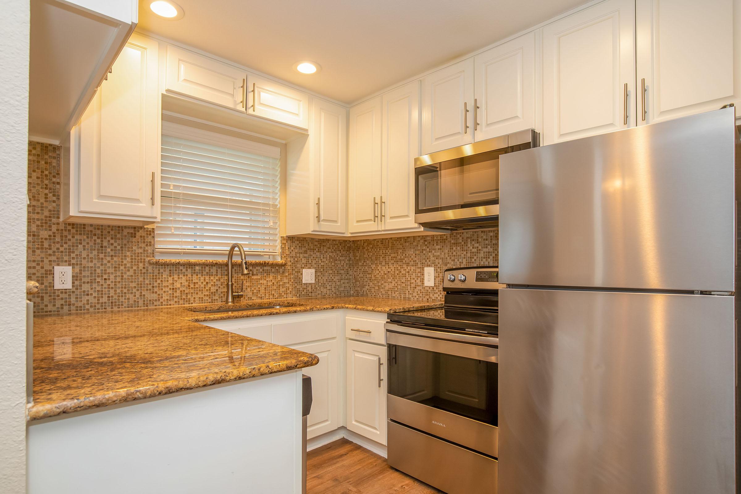 a stainless steel refrigerator in a kitchen