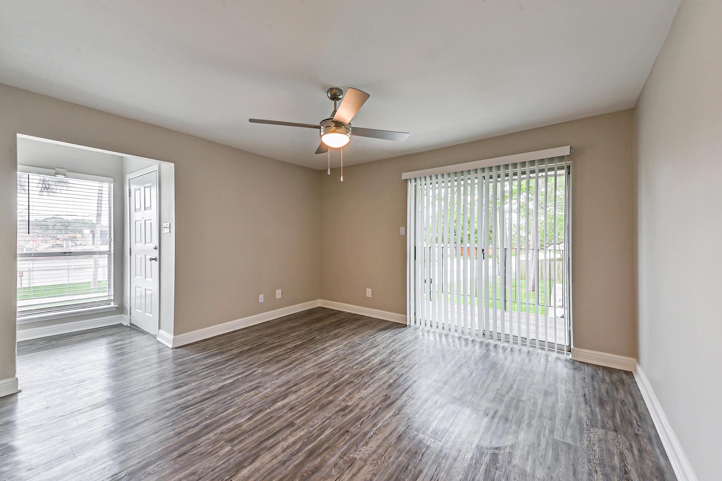 a room filled with furniture and a large window