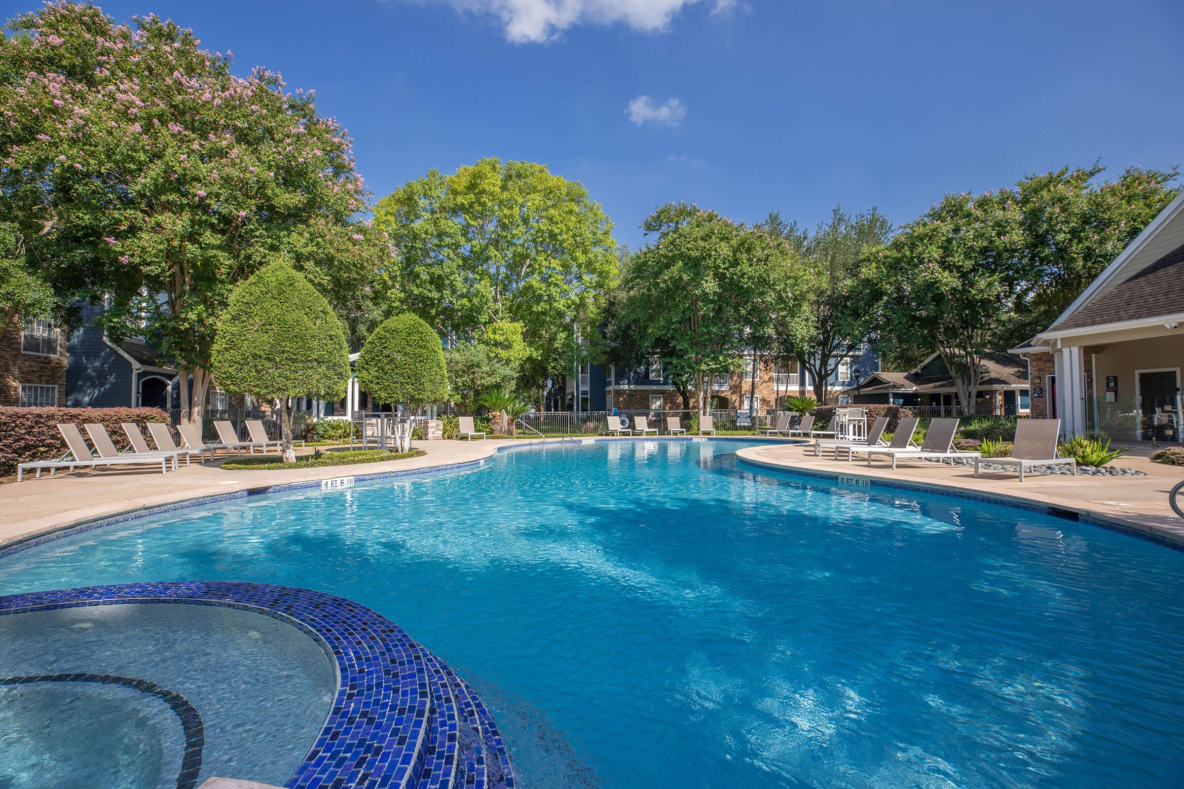 a pool next to a body of water