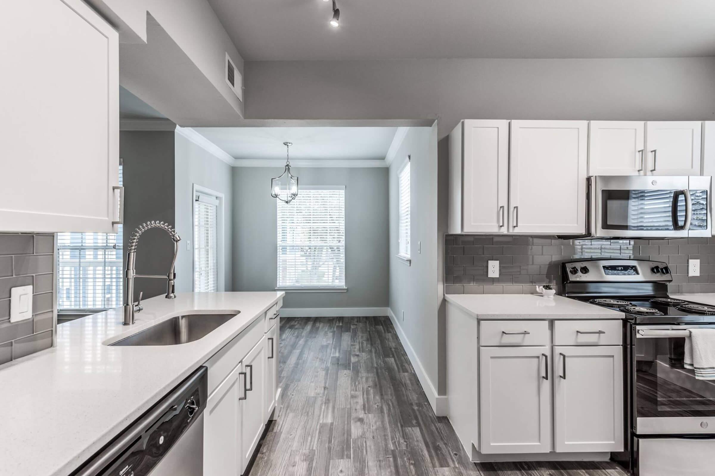 a large kitchen with stainless steel appliances