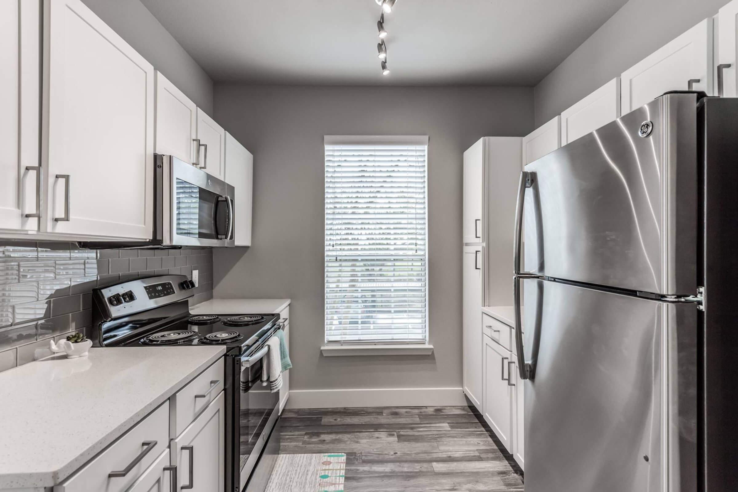 a stainless steel refrigerator in a kitchen