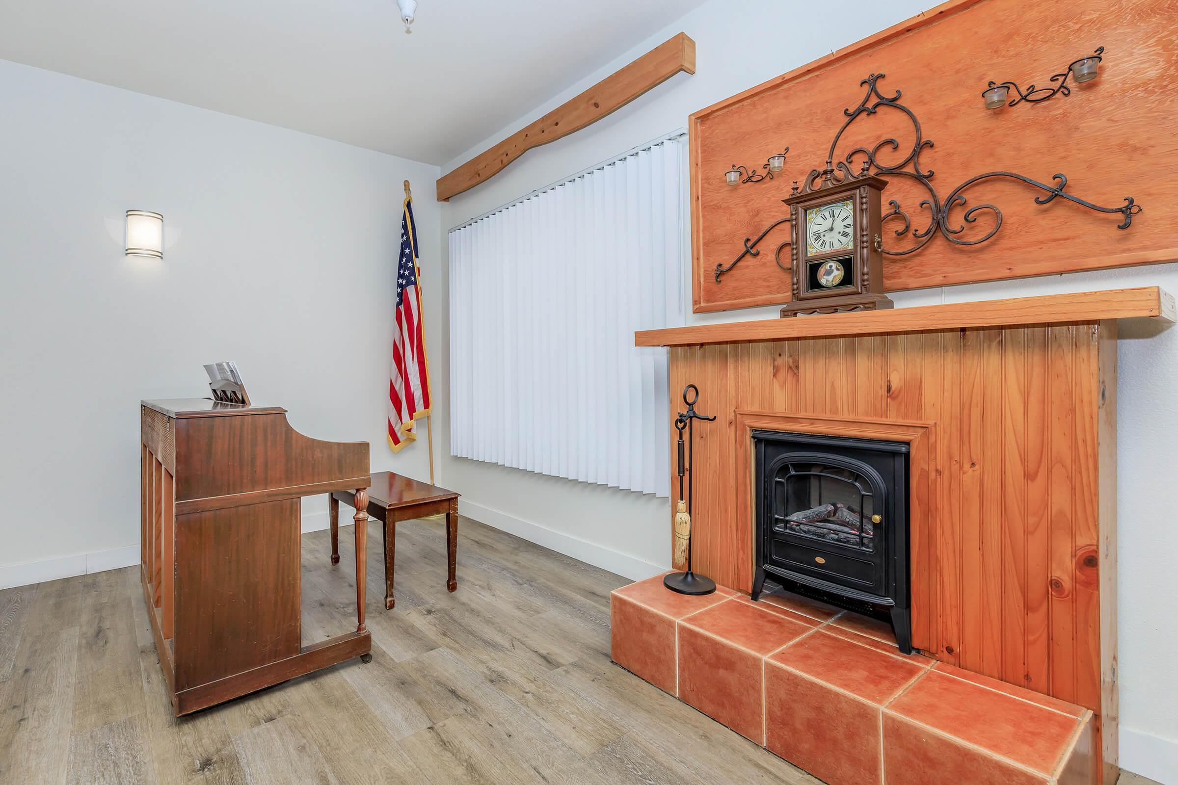 a living room next to a fireplace