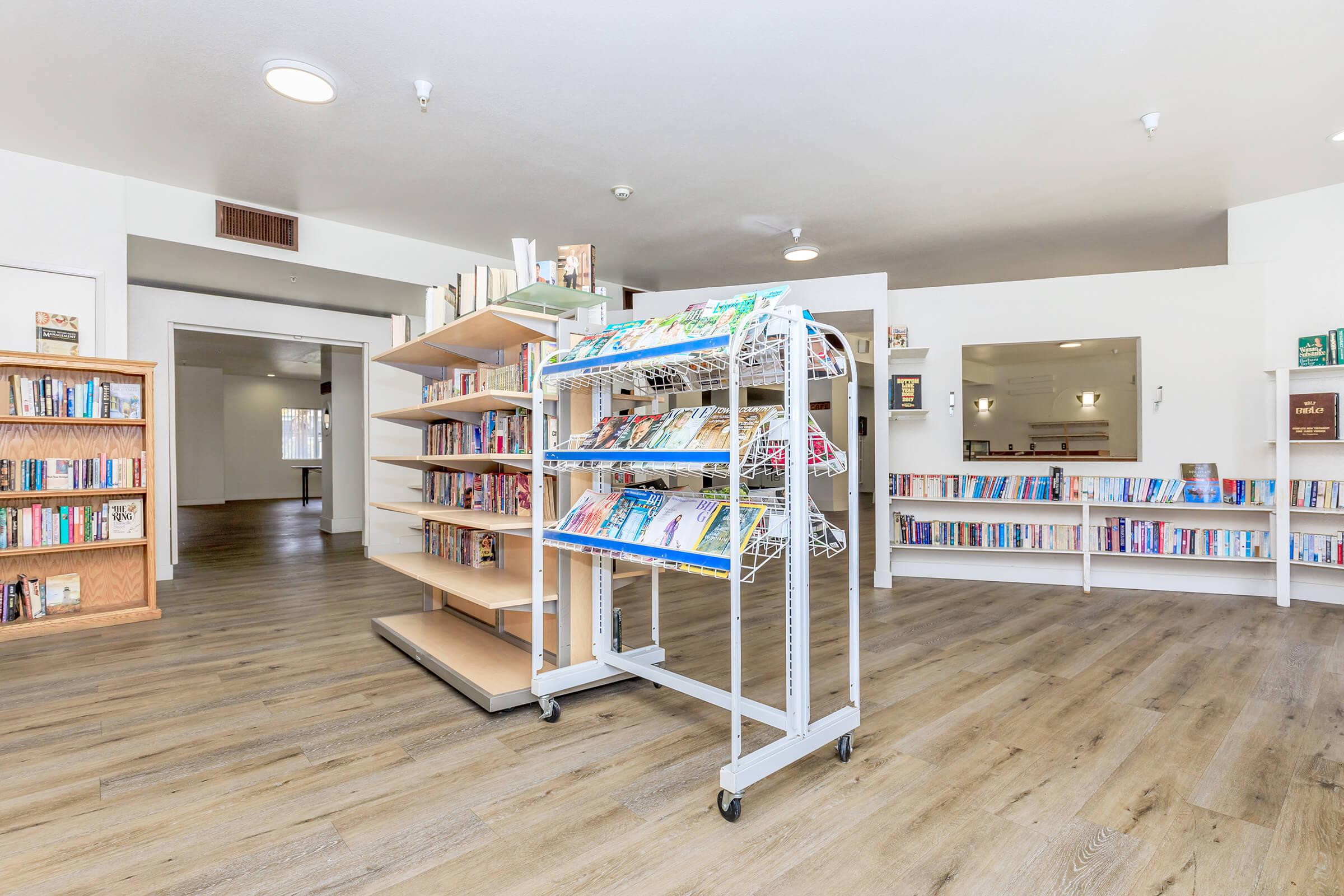 a room filled with furniture and a book shelf