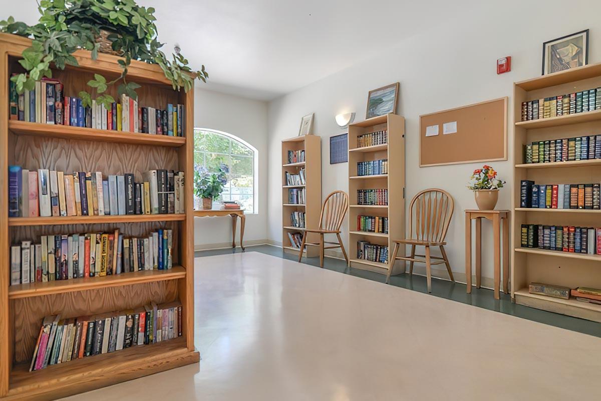 a living room with a book shelf