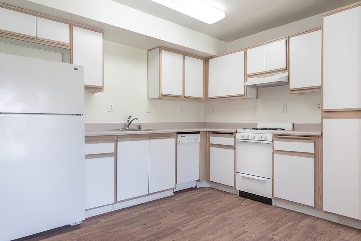 a kitchen with a building in the background