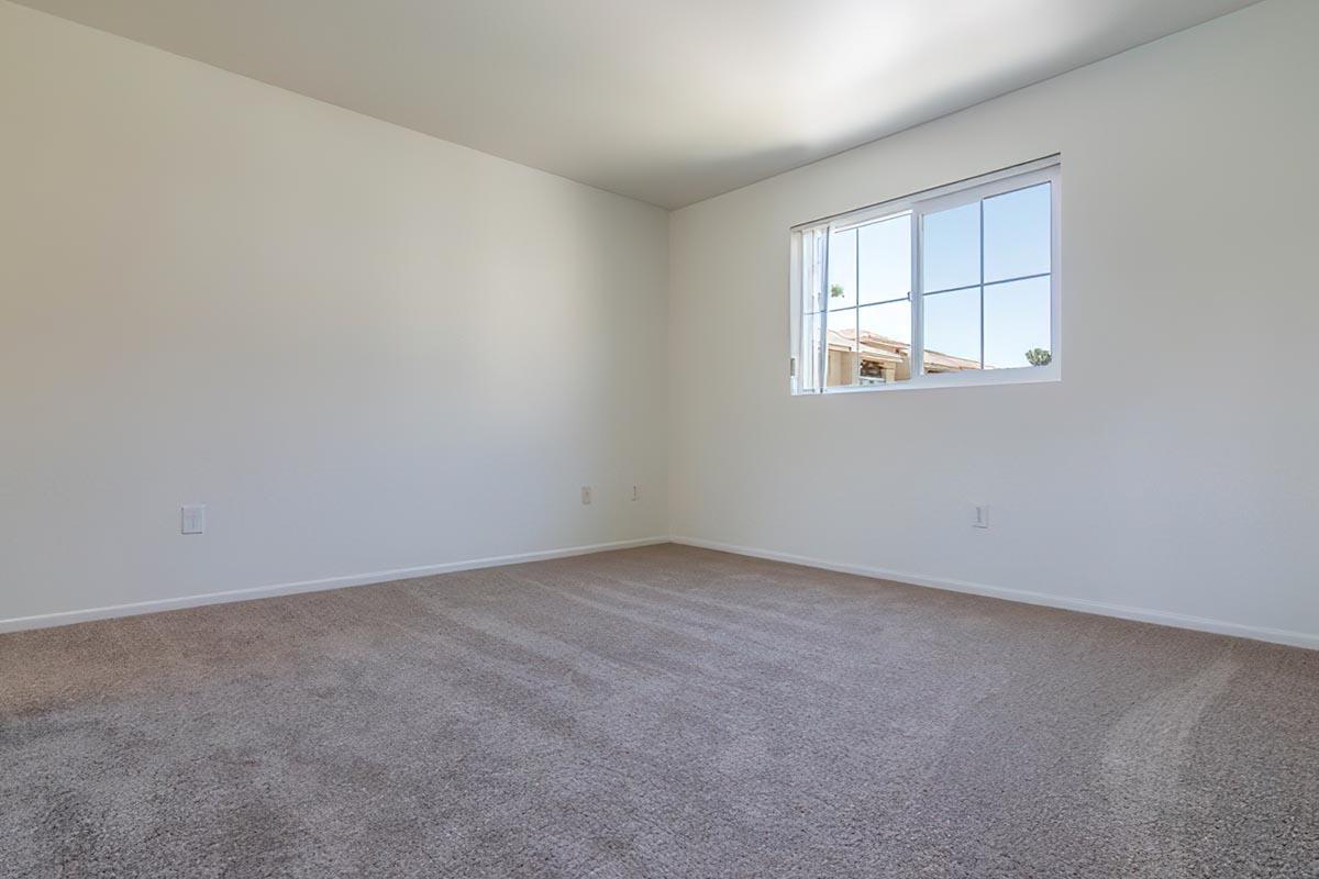 a bedroom with a large window