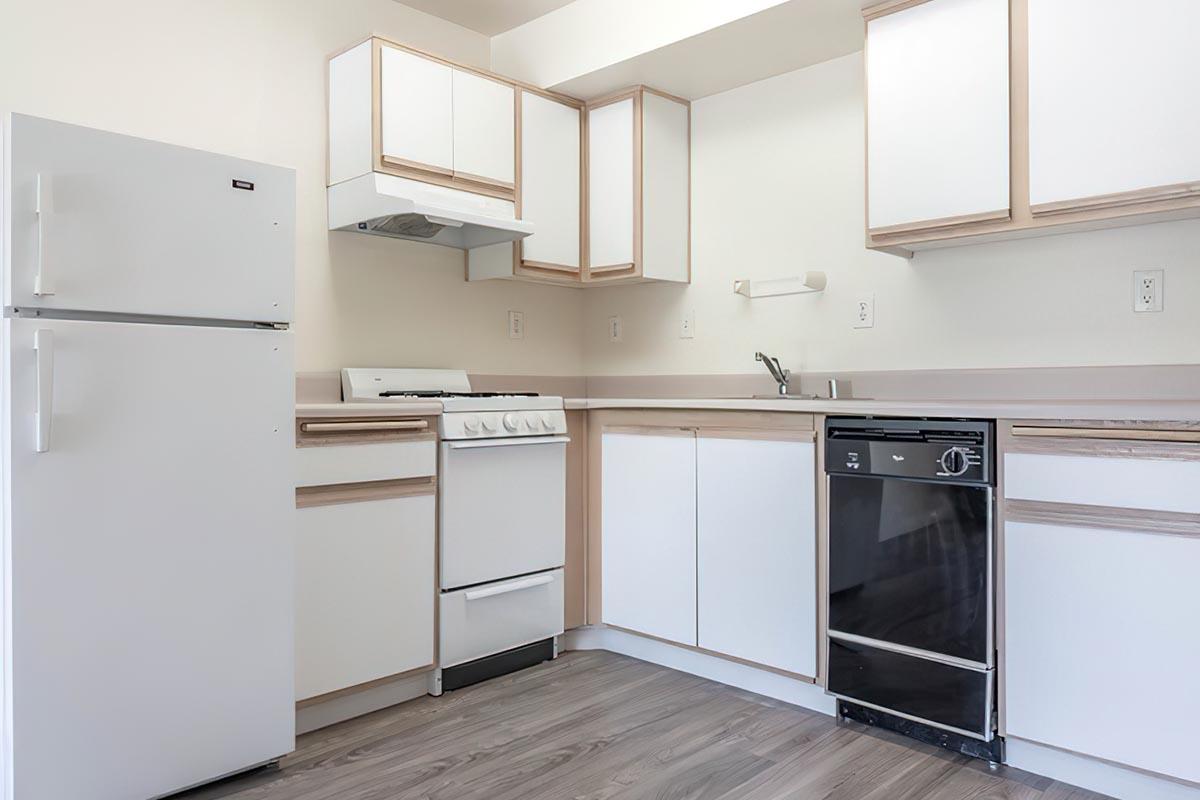 a kitchen with a stove top oven sitting inside of a refrigerator