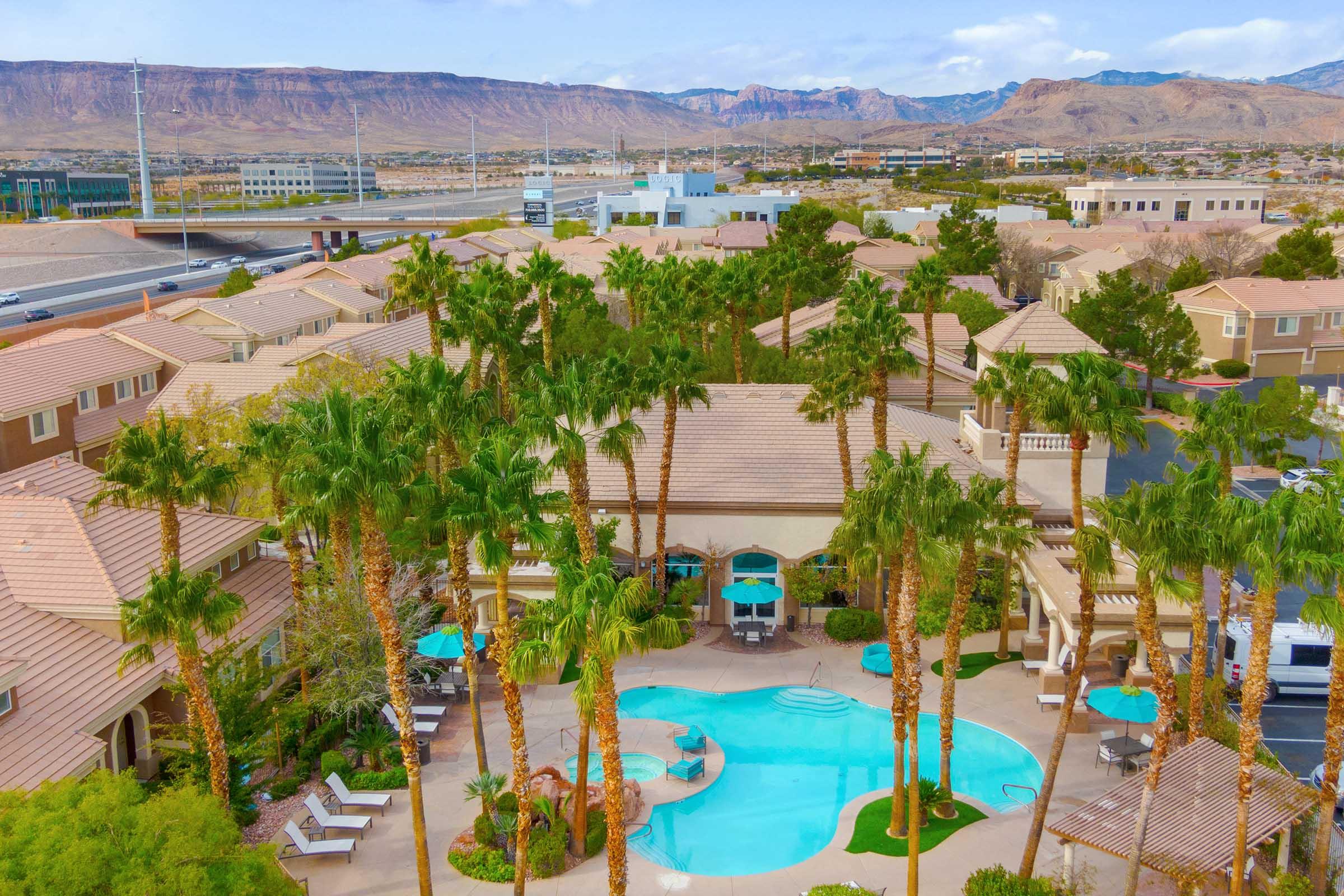 aerial view of pool with. mountains