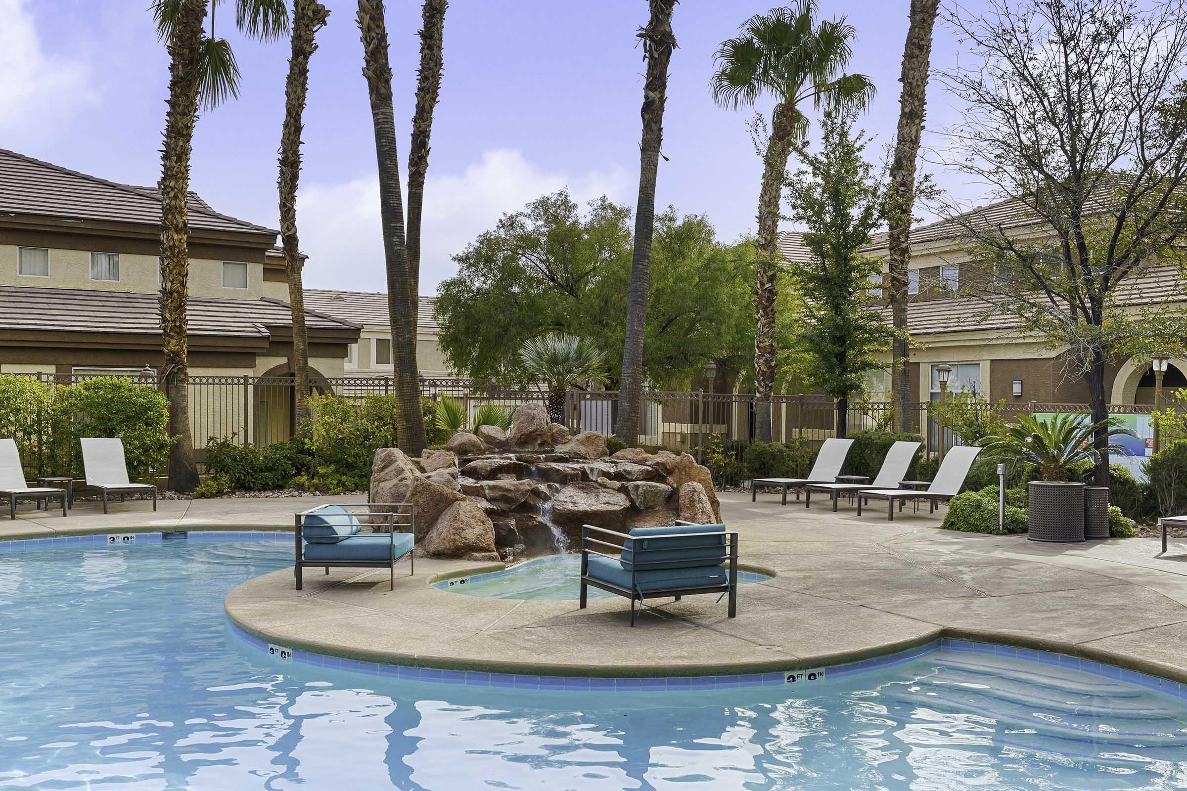 pool with lounge chairs