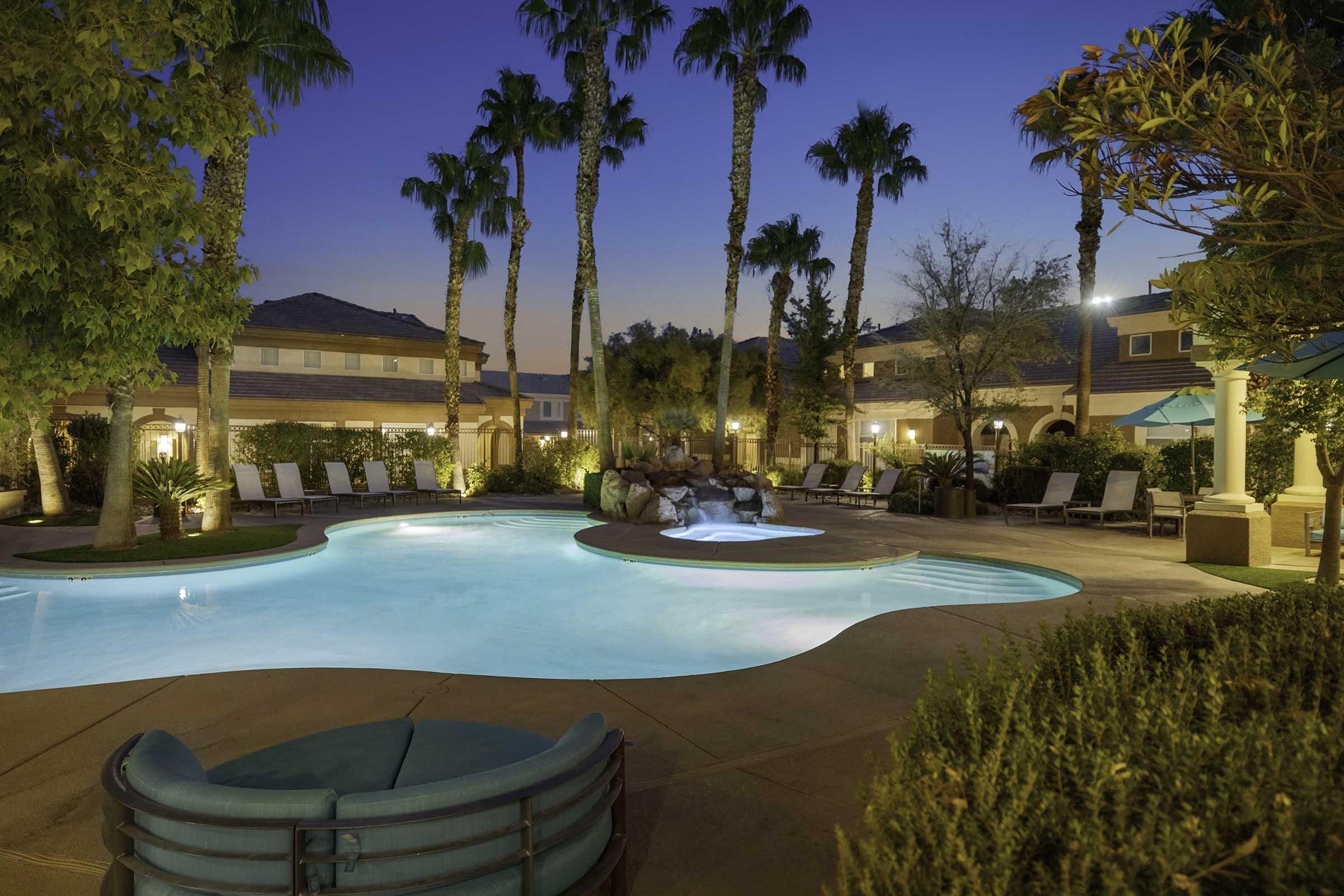 water feature next to swimming pool