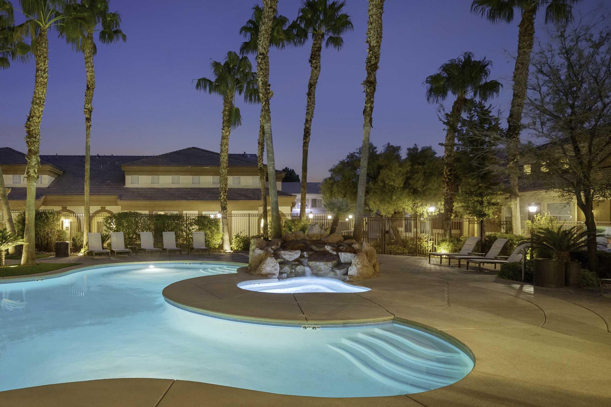 pool with lights at dusk