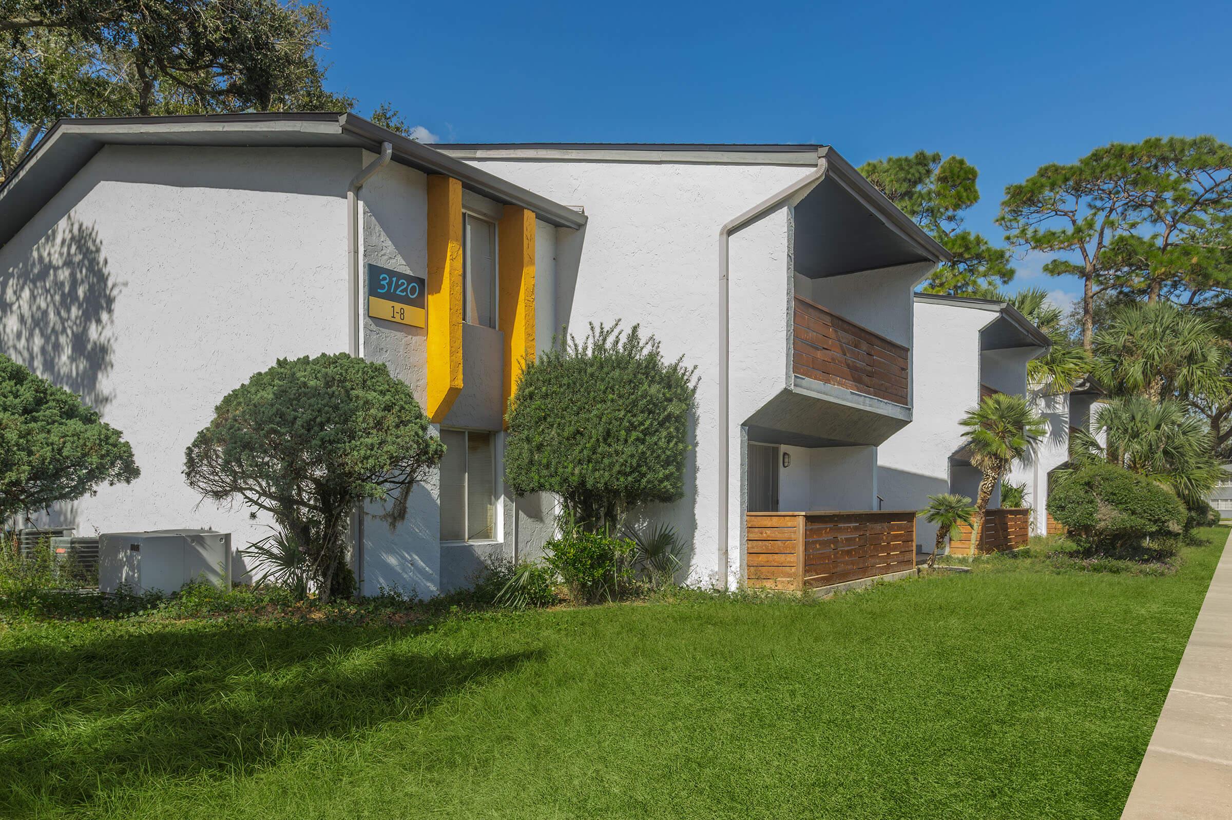 a house with trees in the background