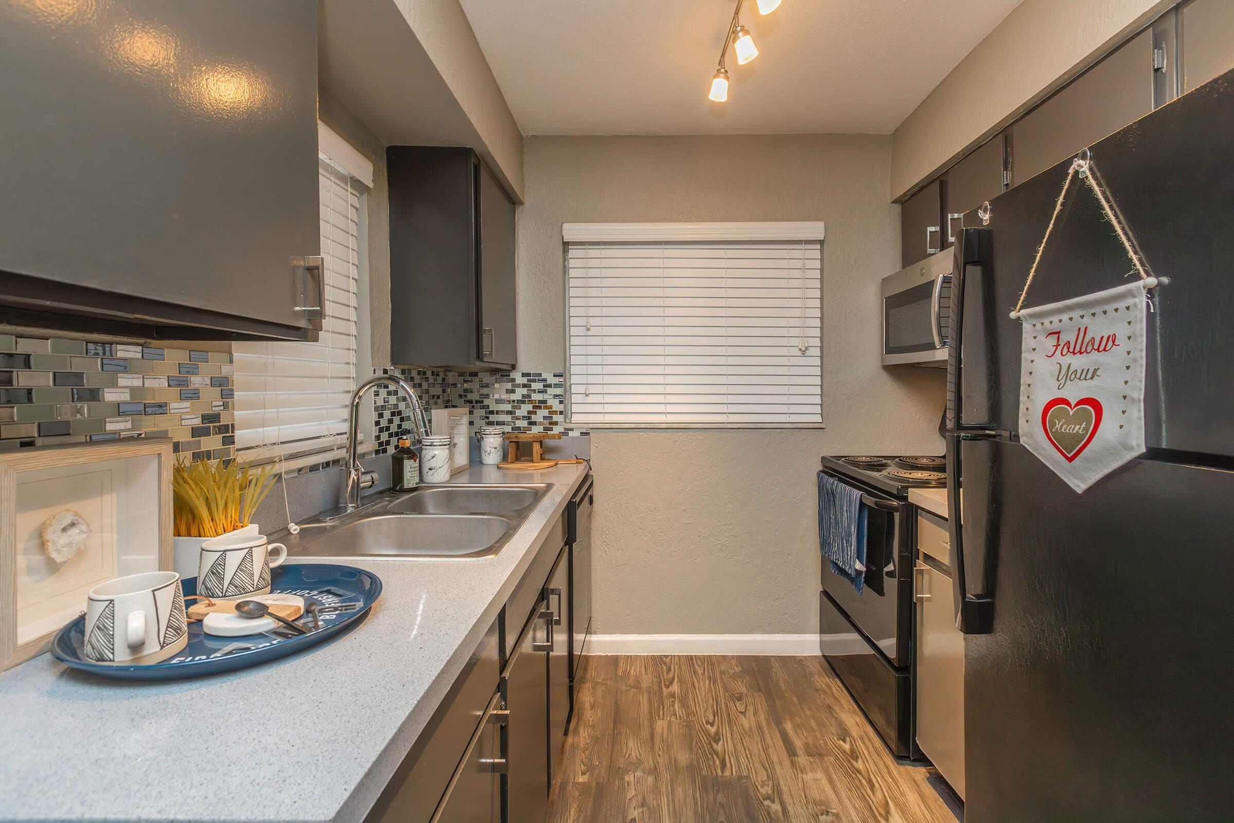 a kitchen with an island in the middle of a room