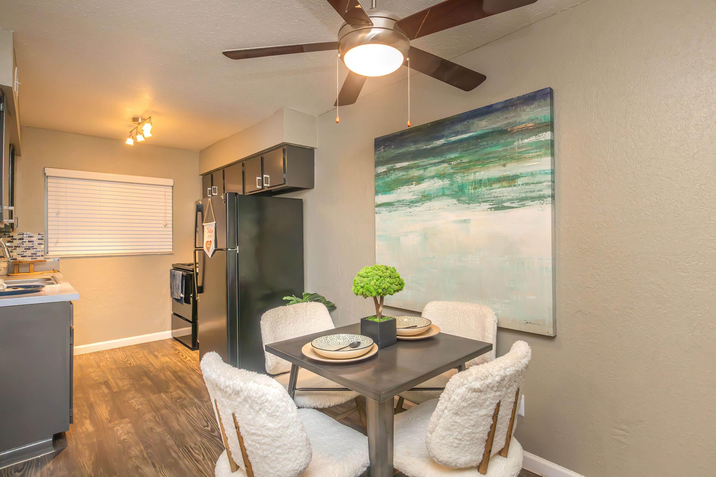 a kitchen with a table in a room