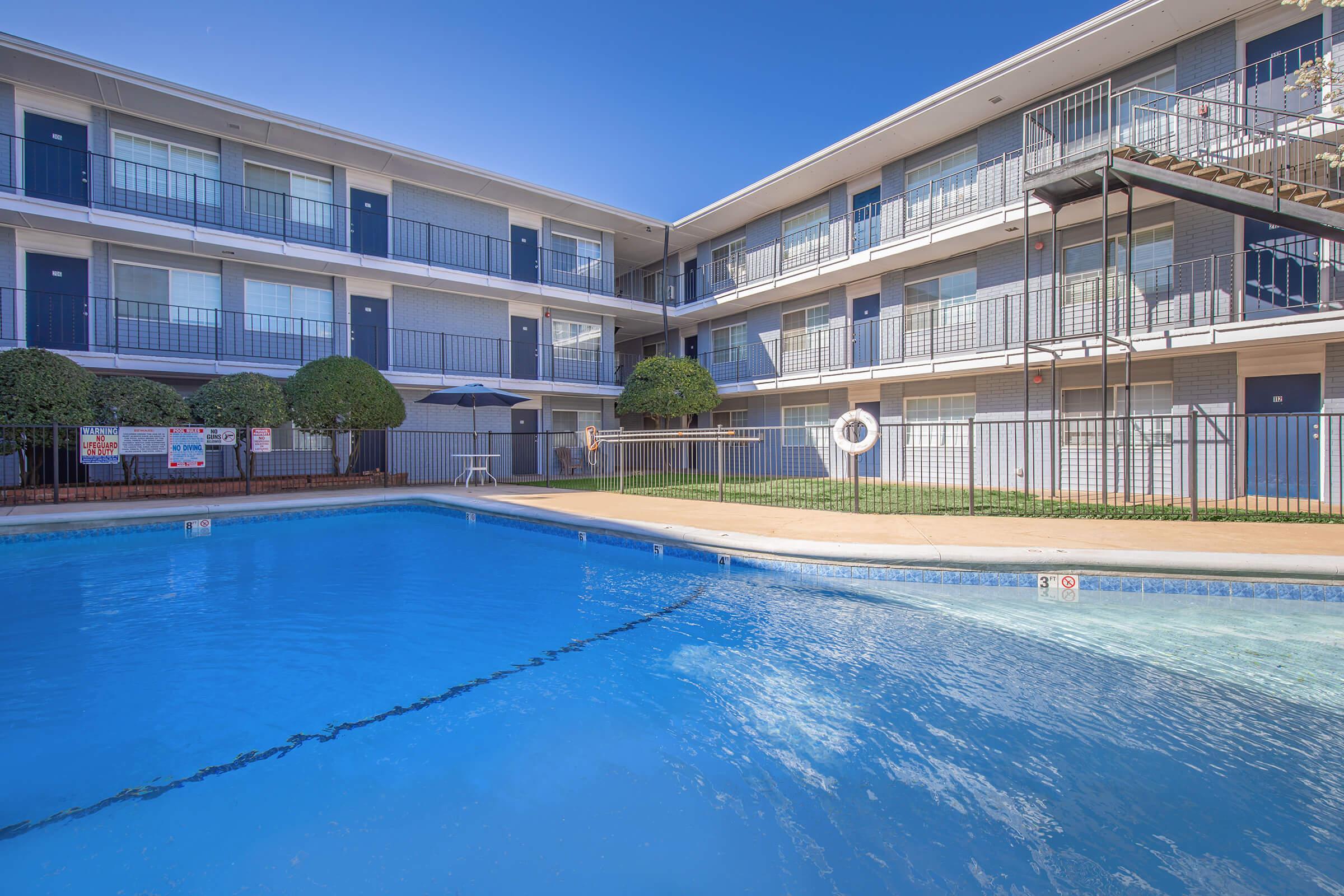 a large pool of water in front of a building