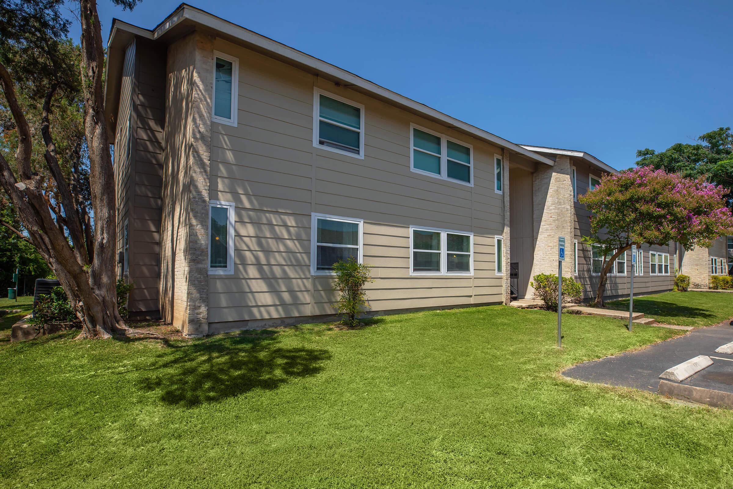 a large lawn in front of a house