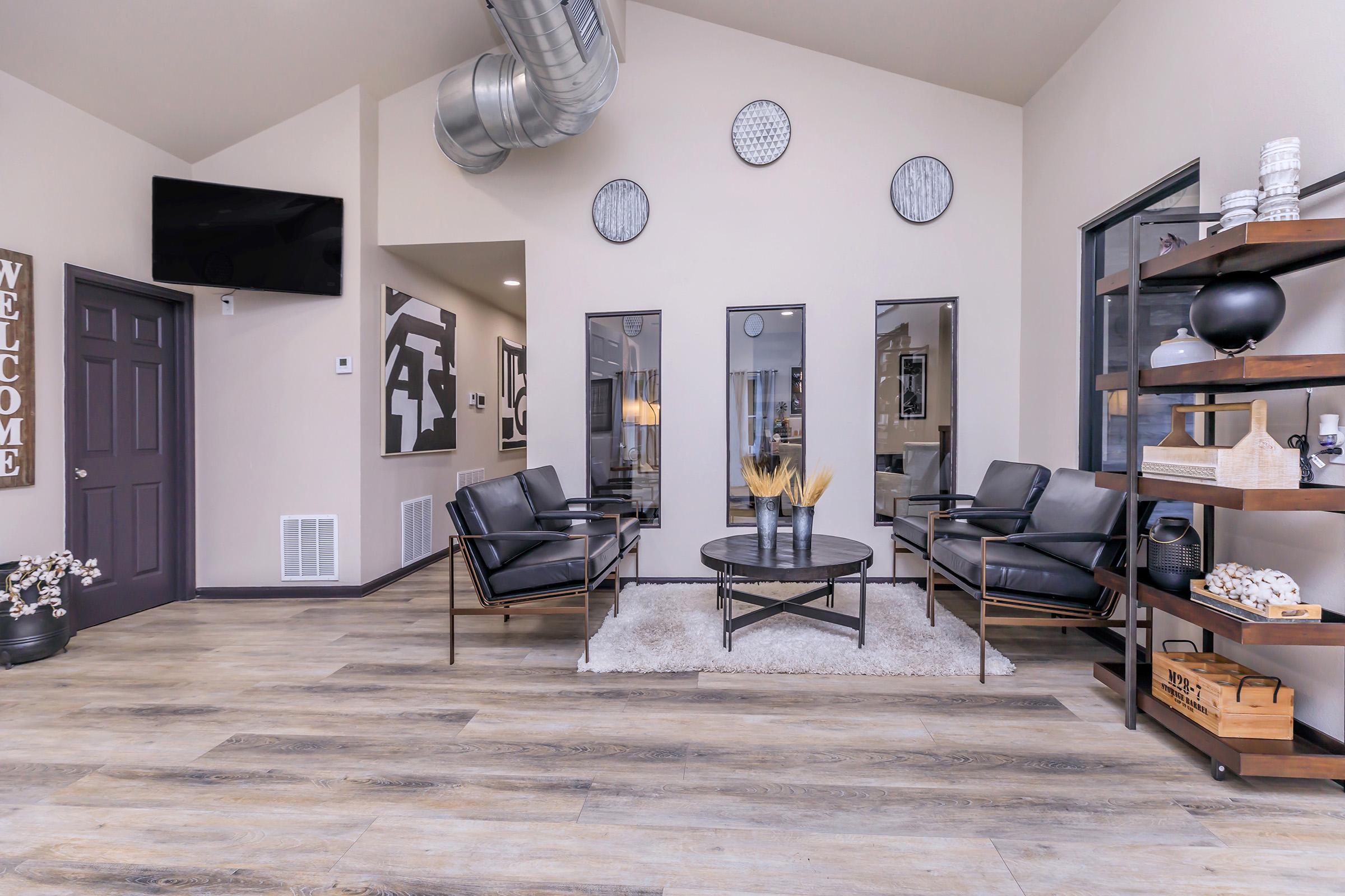 a living room filled with furniture and a fireplace