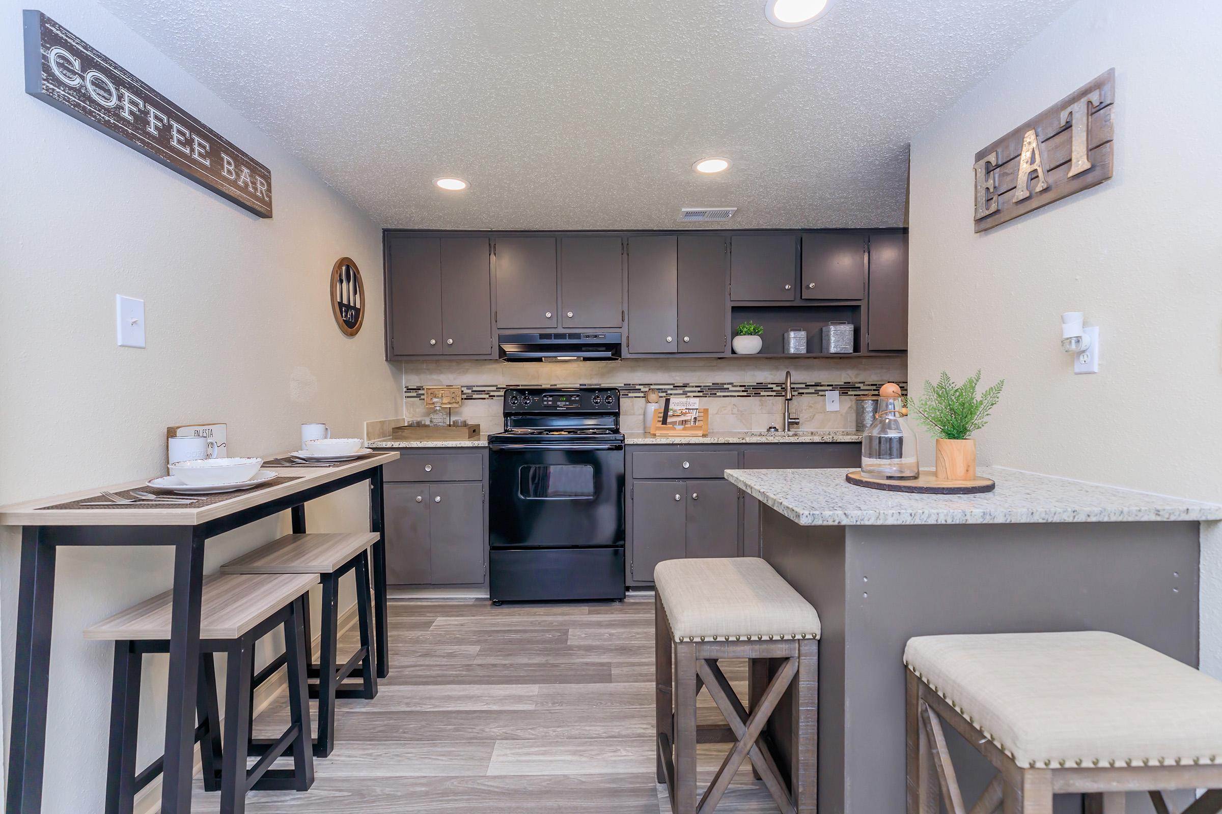 a kitchen with a table in a room