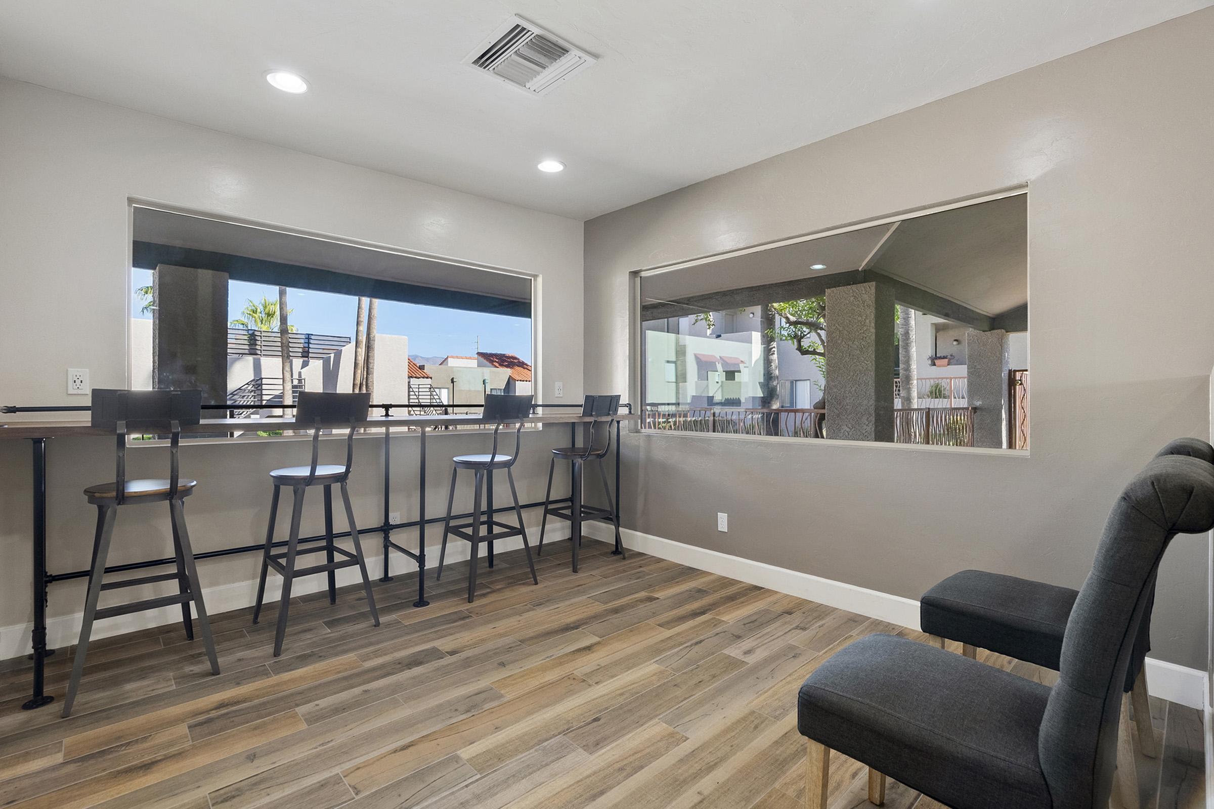 a room filled with furniture and a large window