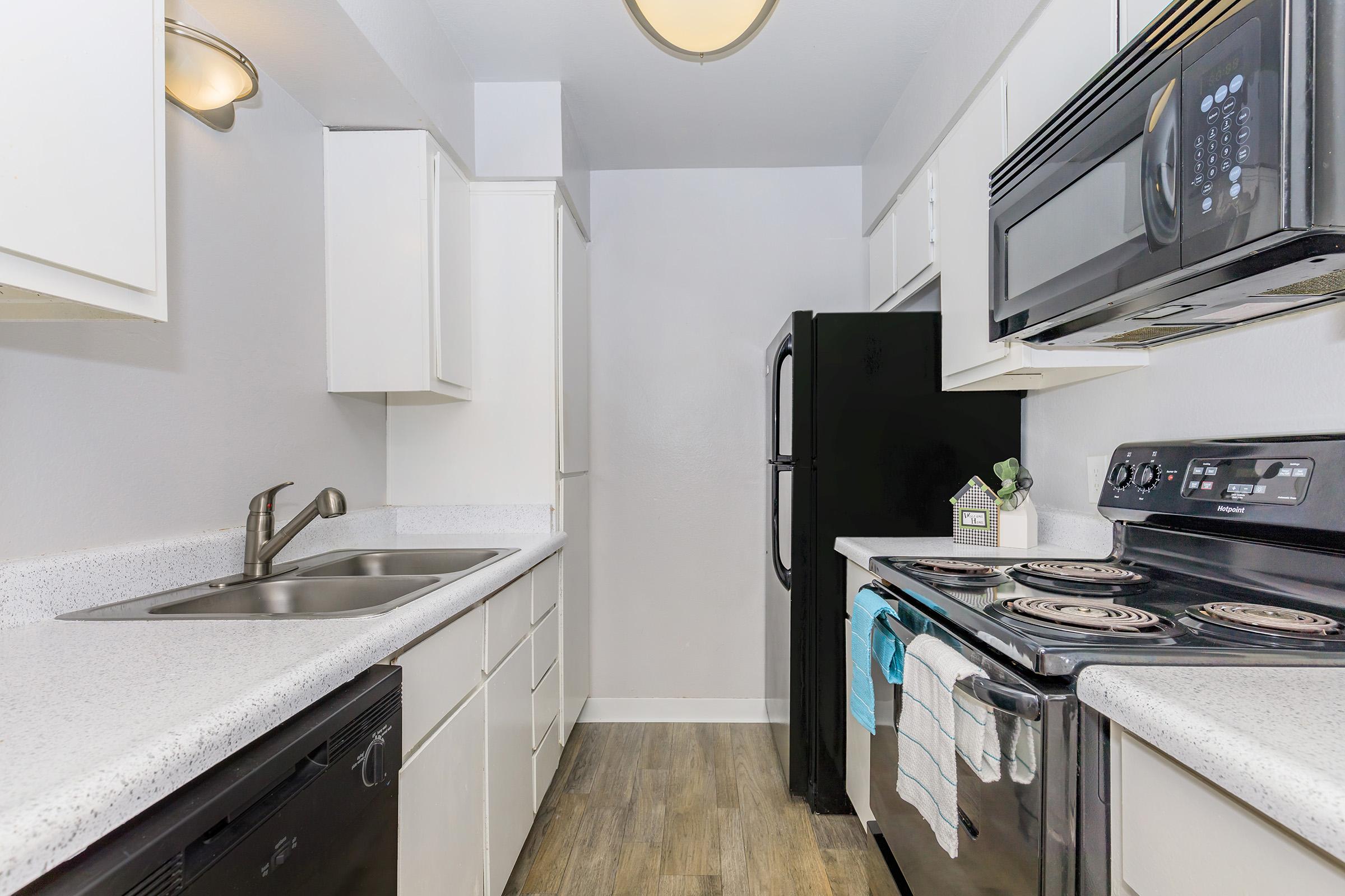 a kitchen with a stove and a sink