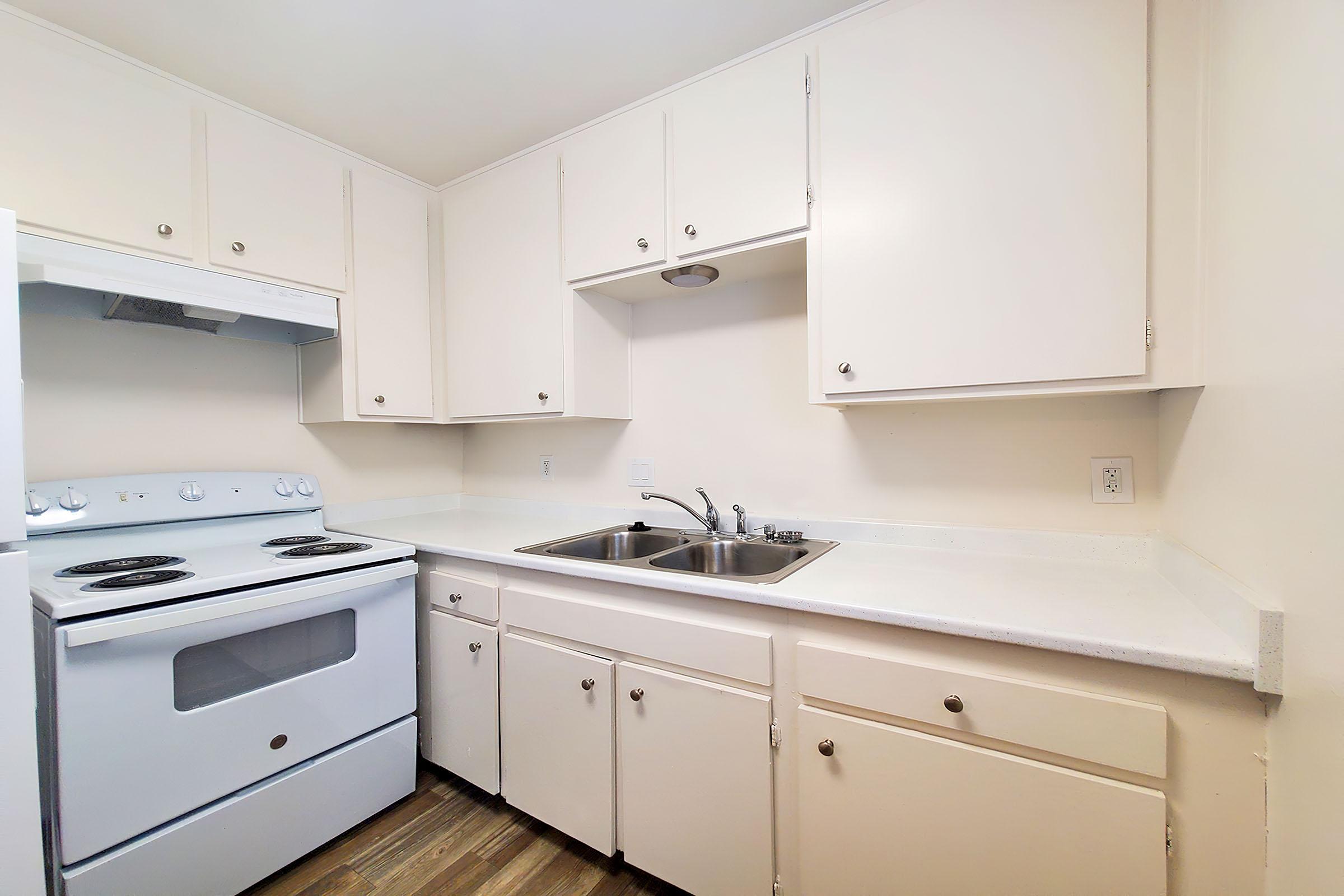 a kitchen with a stove top oven