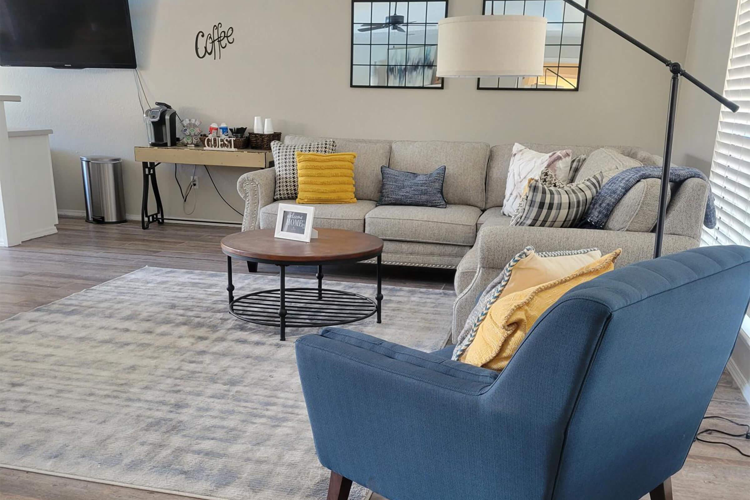 a living room with a leather chair