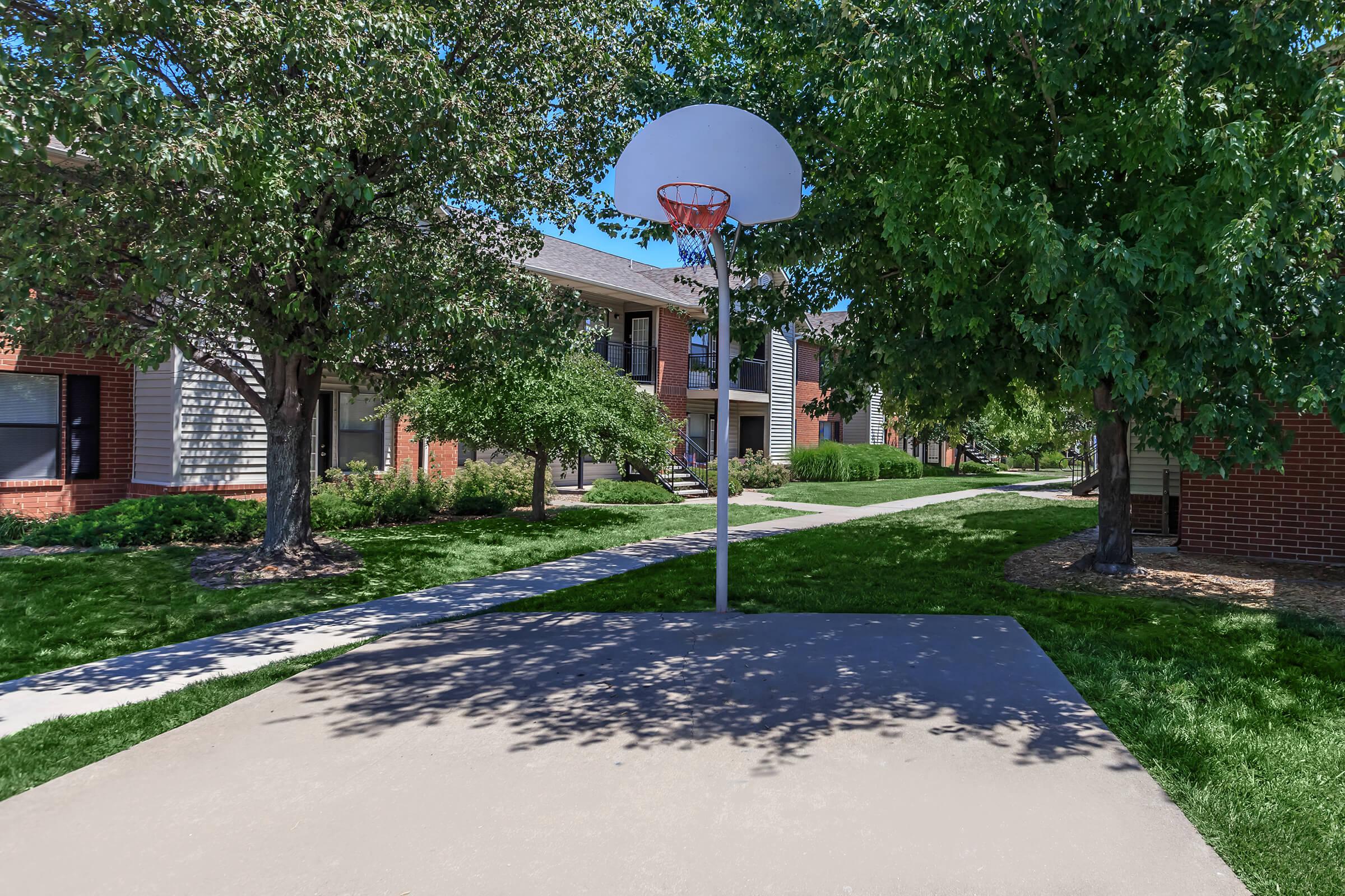 a house that has a sign on the side of a road