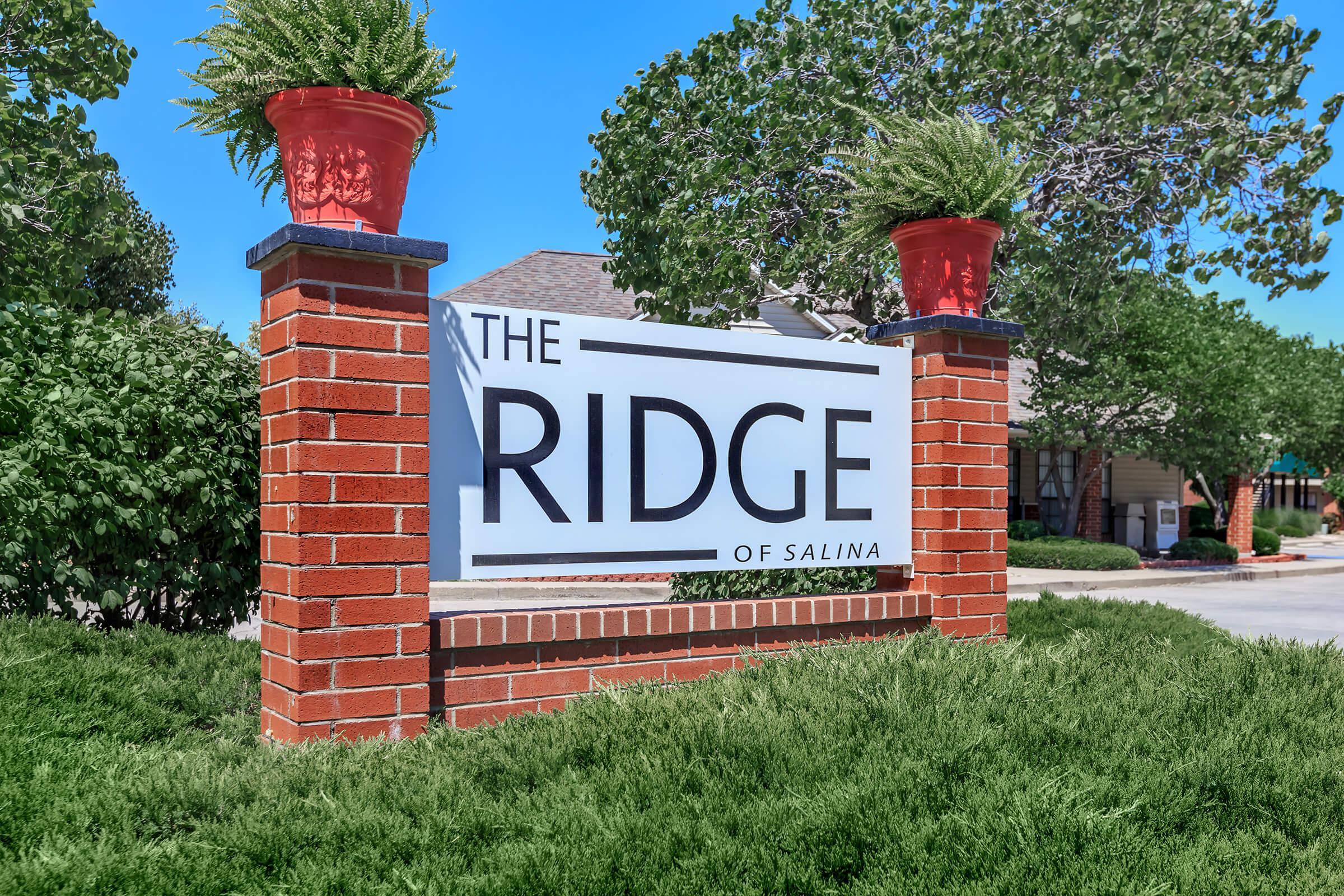 a sign in front of a brick building