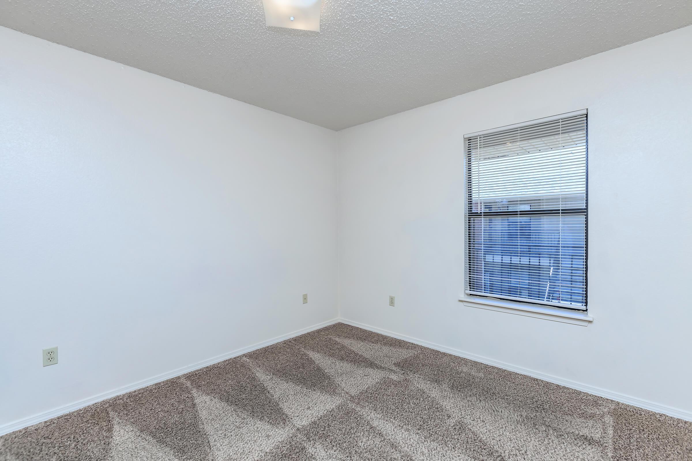 a room with a sink and a window