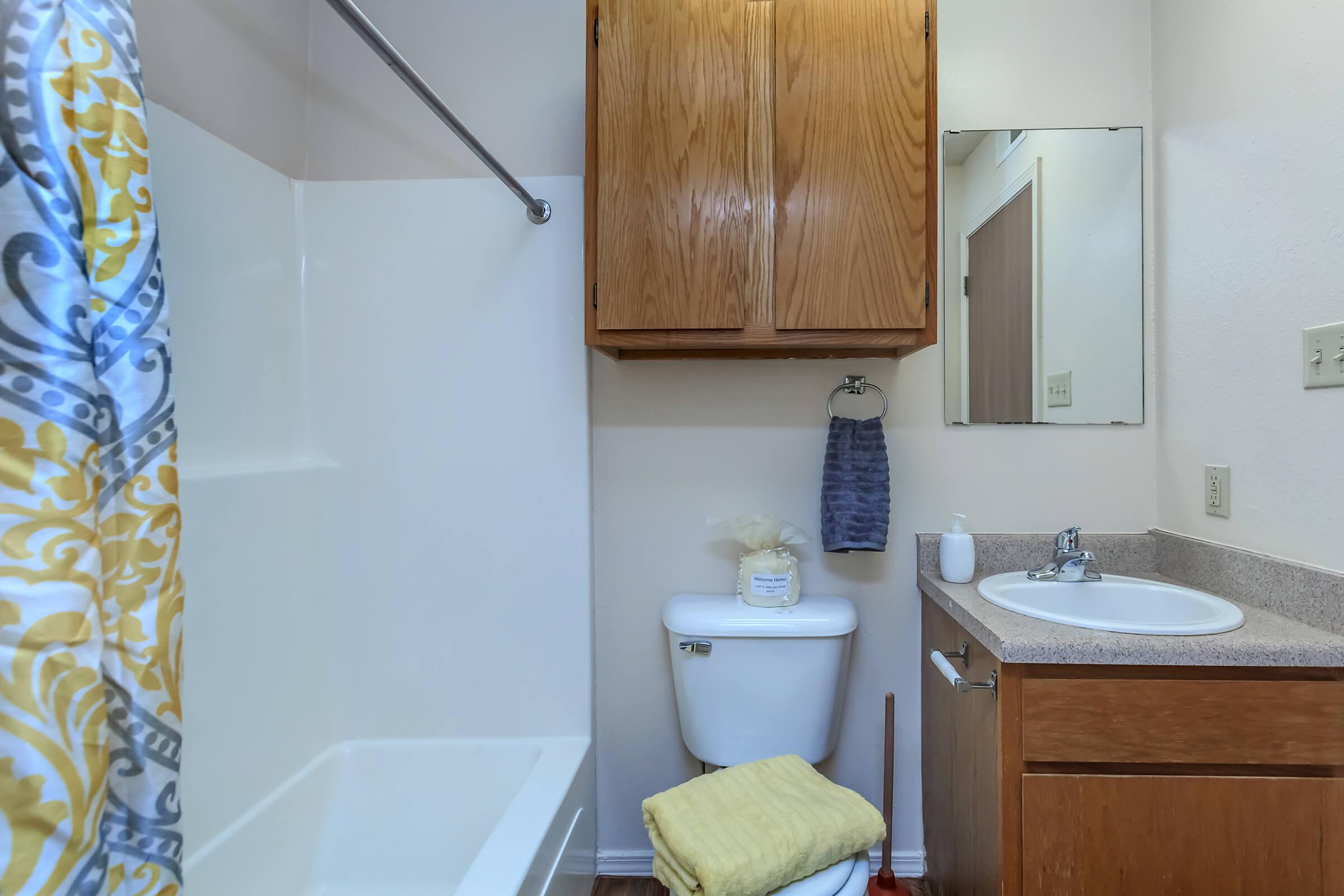 a kitchen with a sink and a mirror