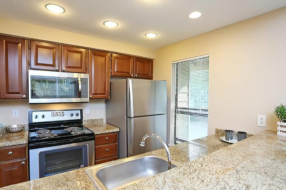 a modern kitchen with stainless steel appliances