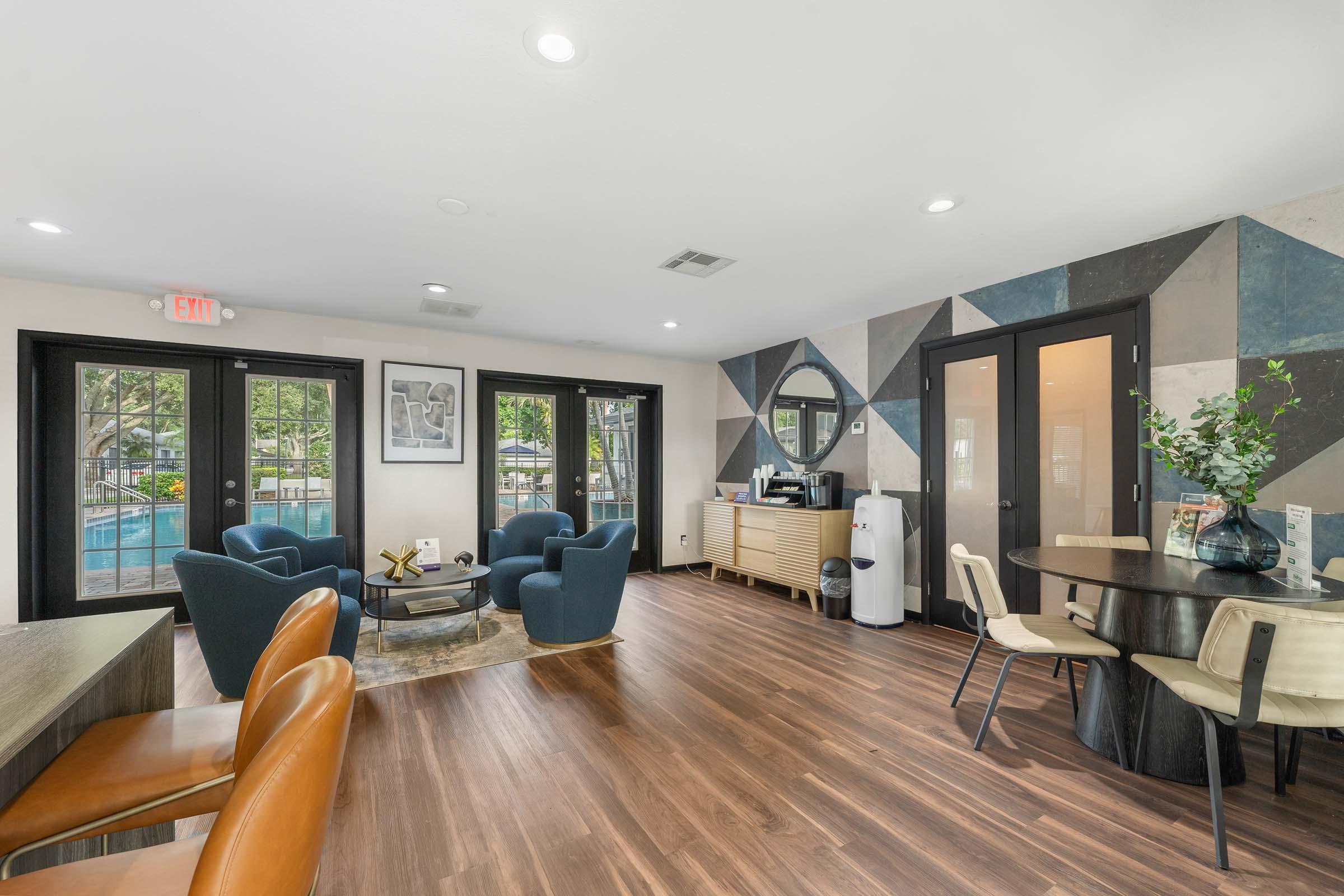 a living room filled with furniture and a large window