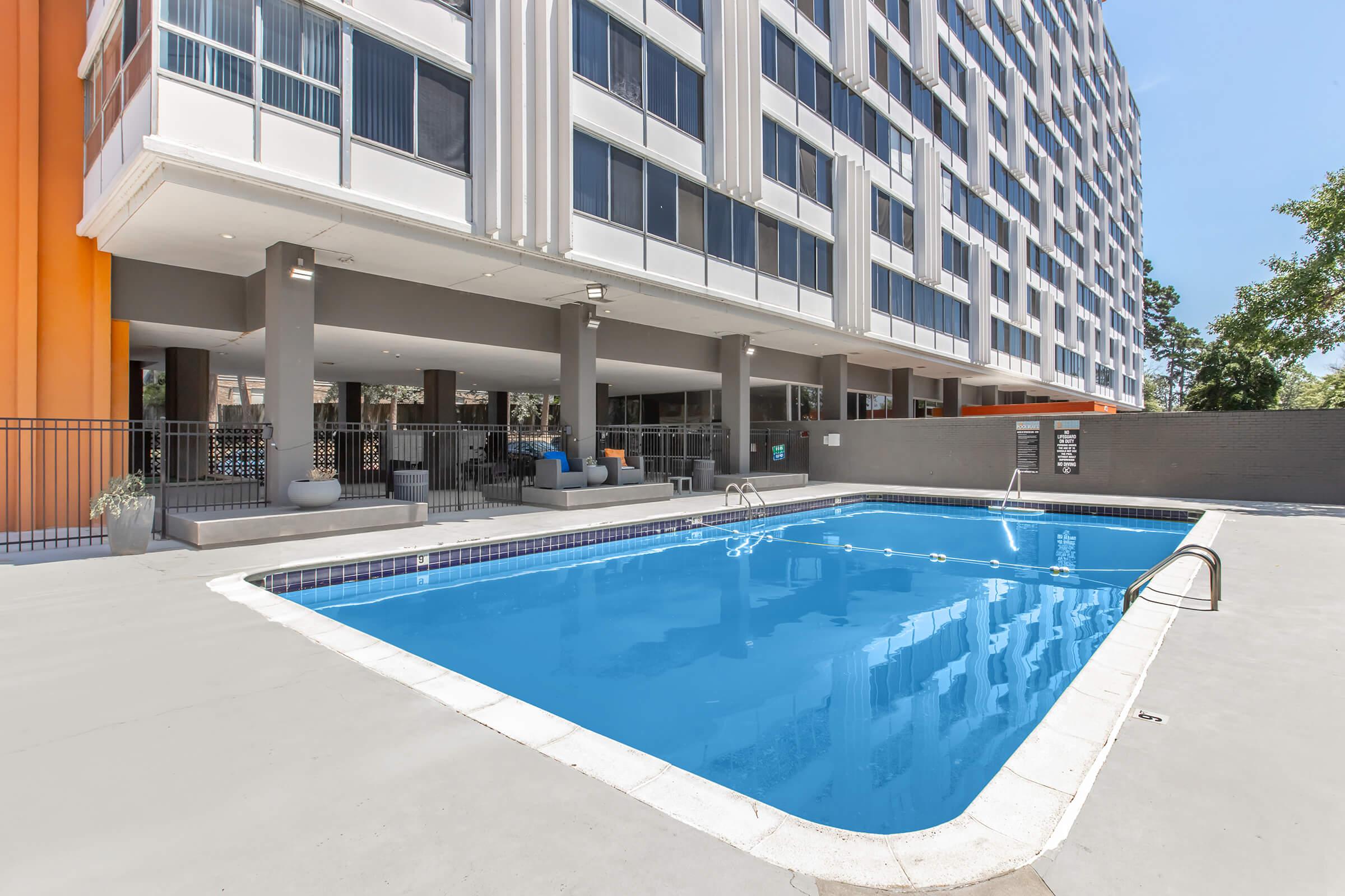 a pool next to a building