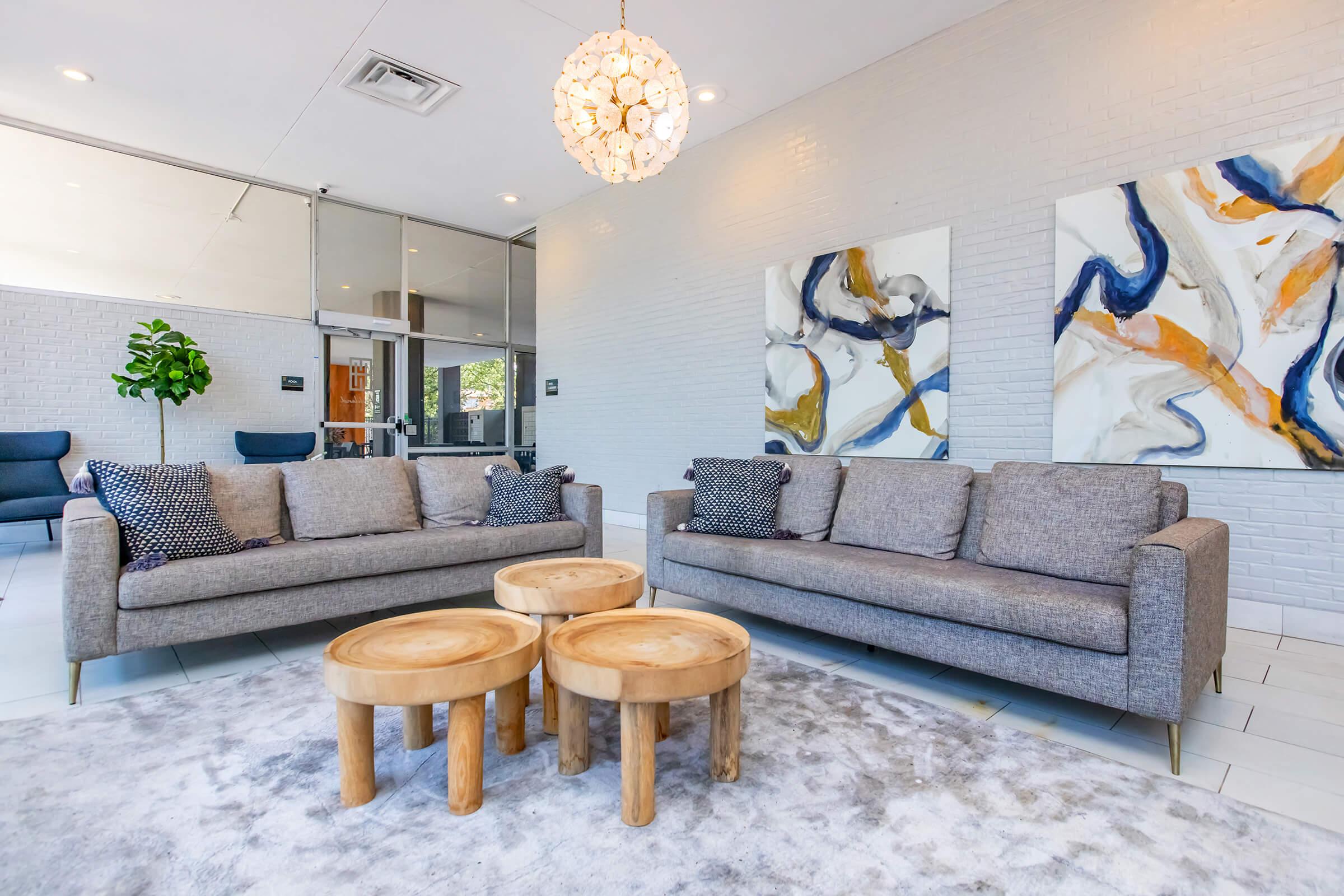 a living room filled with furniture and a fireplace