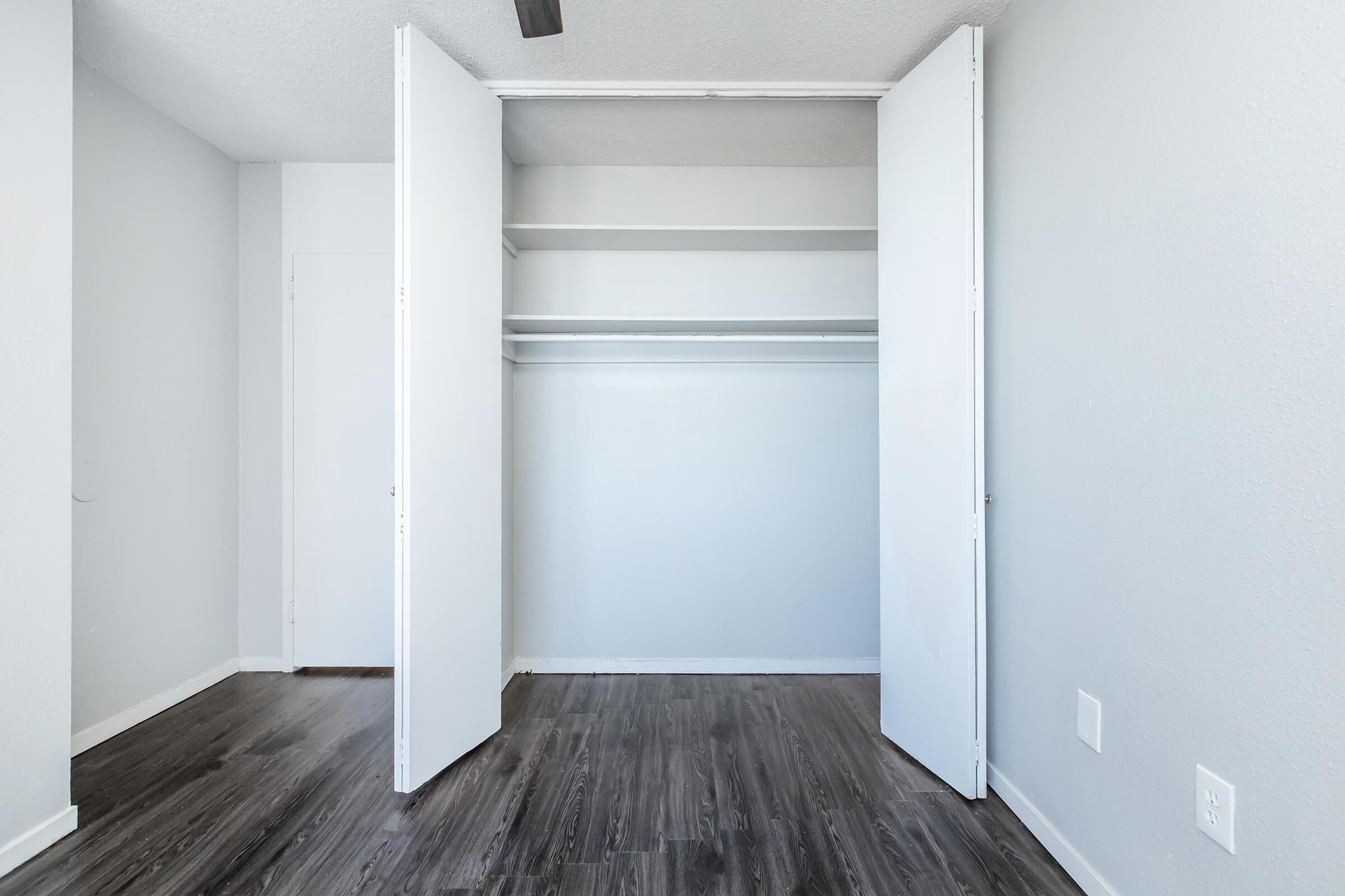 a refrigerator freezer sitting inside of a building