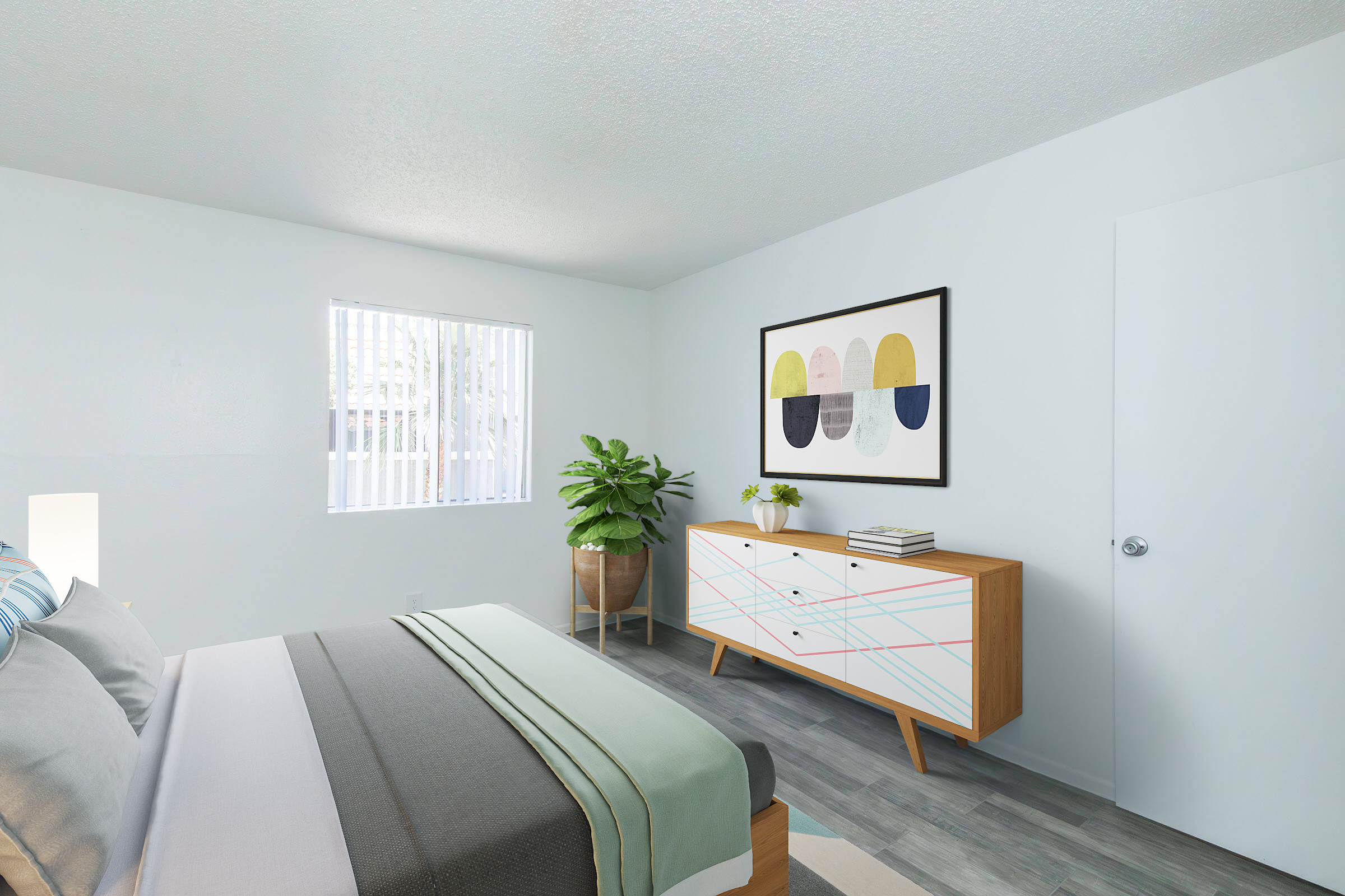 A modern bedroom featuring a bed with gray and pastel-colored linens, a stylish dresser with geometric patterns, and a framed abstract artwork on the wall. There's a potted plant in the corner and a window with vertical blinds allowing natural light to fill the room.