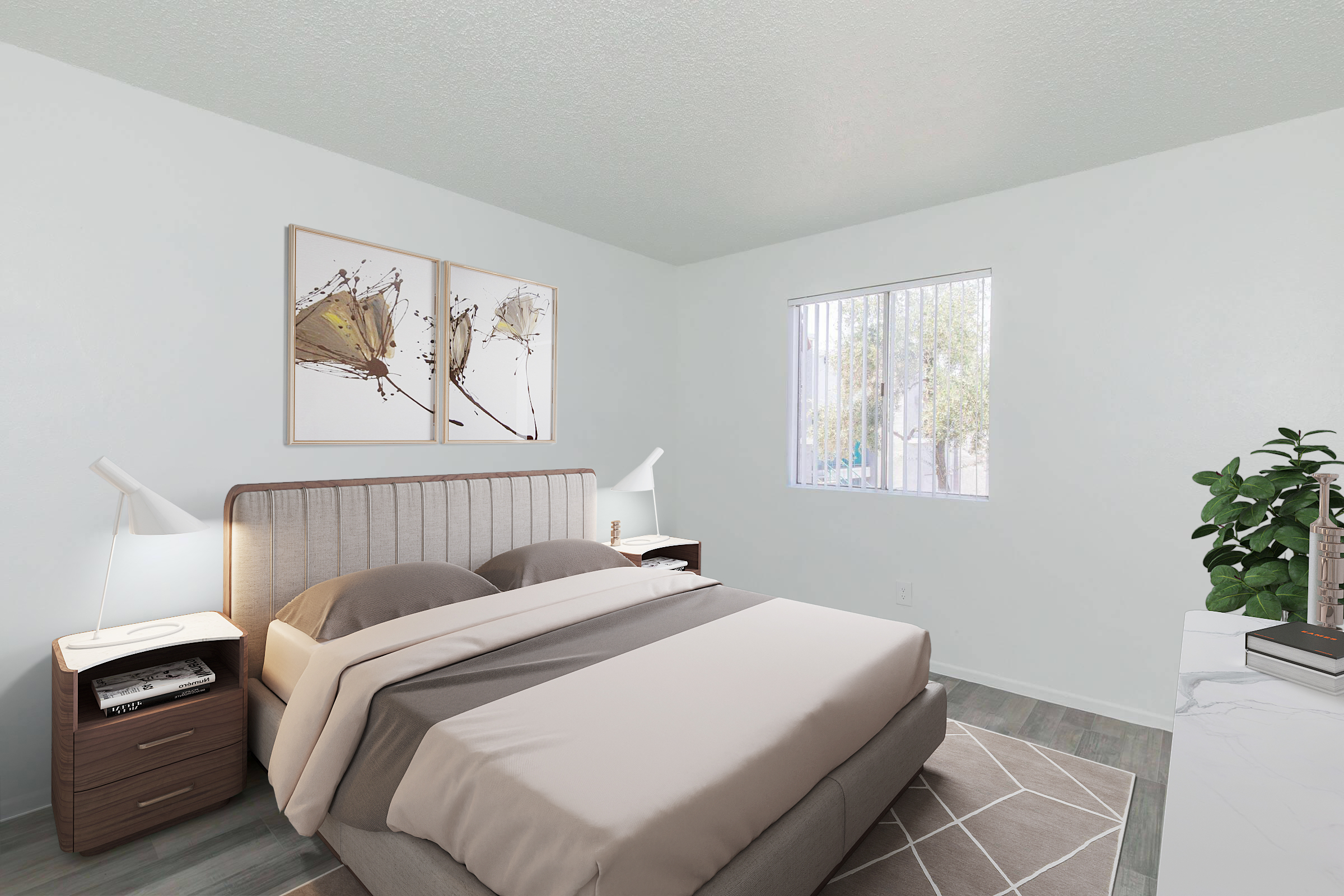 A modern bedroom featuring a upholstered bed with soft beige bedding. There are two wooden nightstands with lamps on either side and framed abstract artwork on the wall. A window allows natural light to enter, and a green plant adds a touch of nature. The flooring is wood-like, complementing the overall decor.
