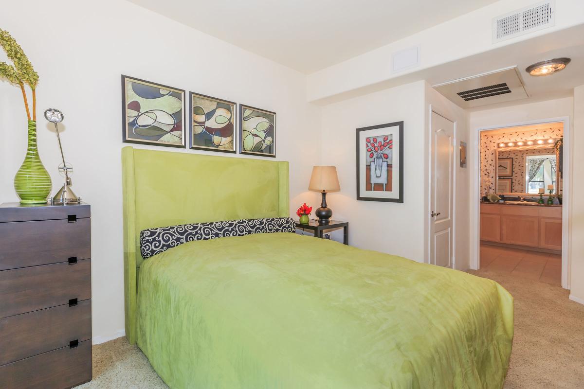 a bedroom with a bed in a room