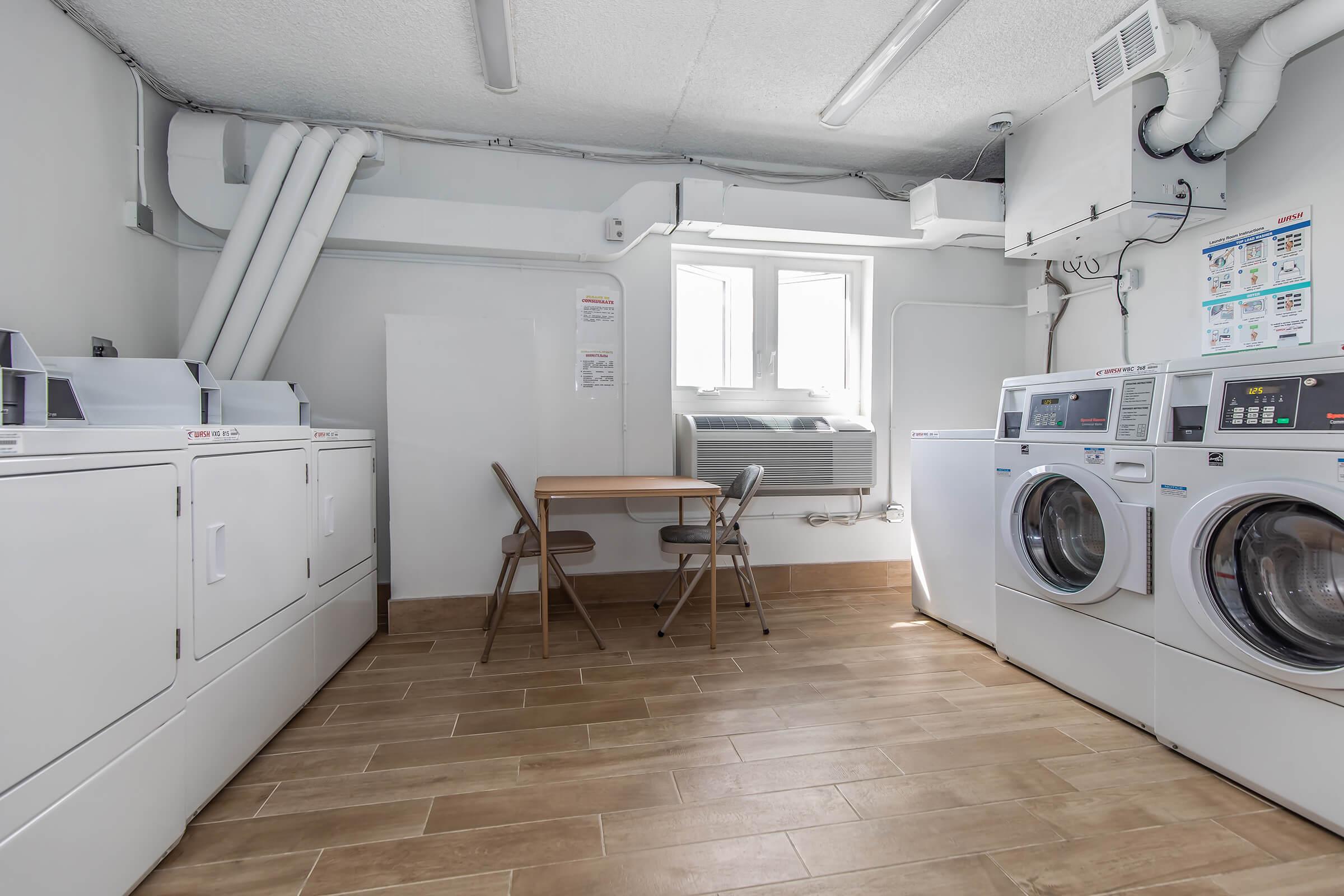 a kitchen with a stove top oven sitting inside of a room