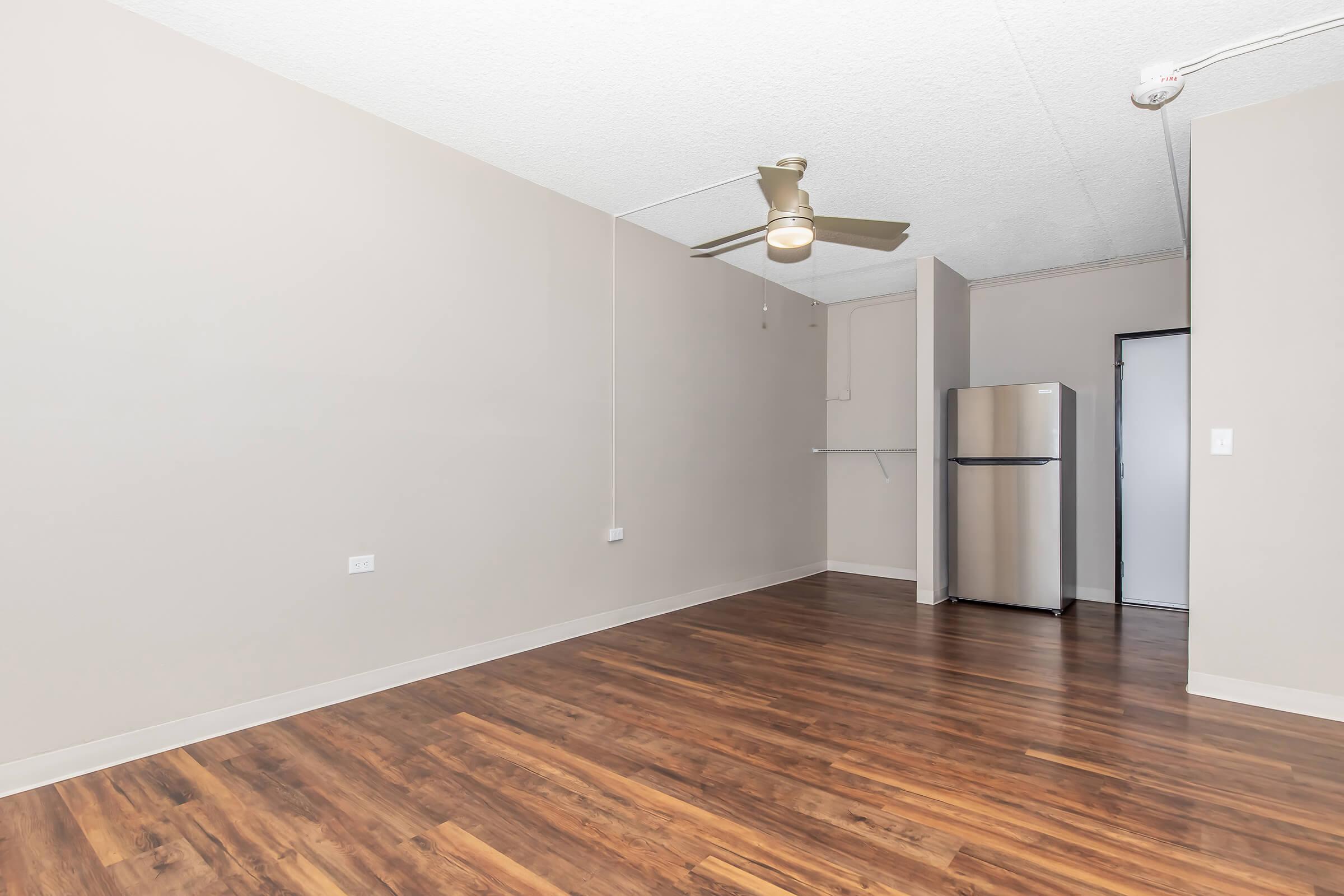 a kitchen with a wood floor