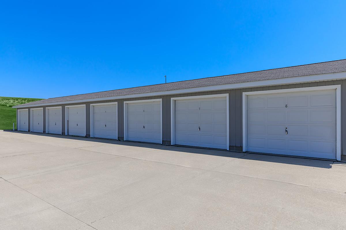 an empty parking lot in front of a building